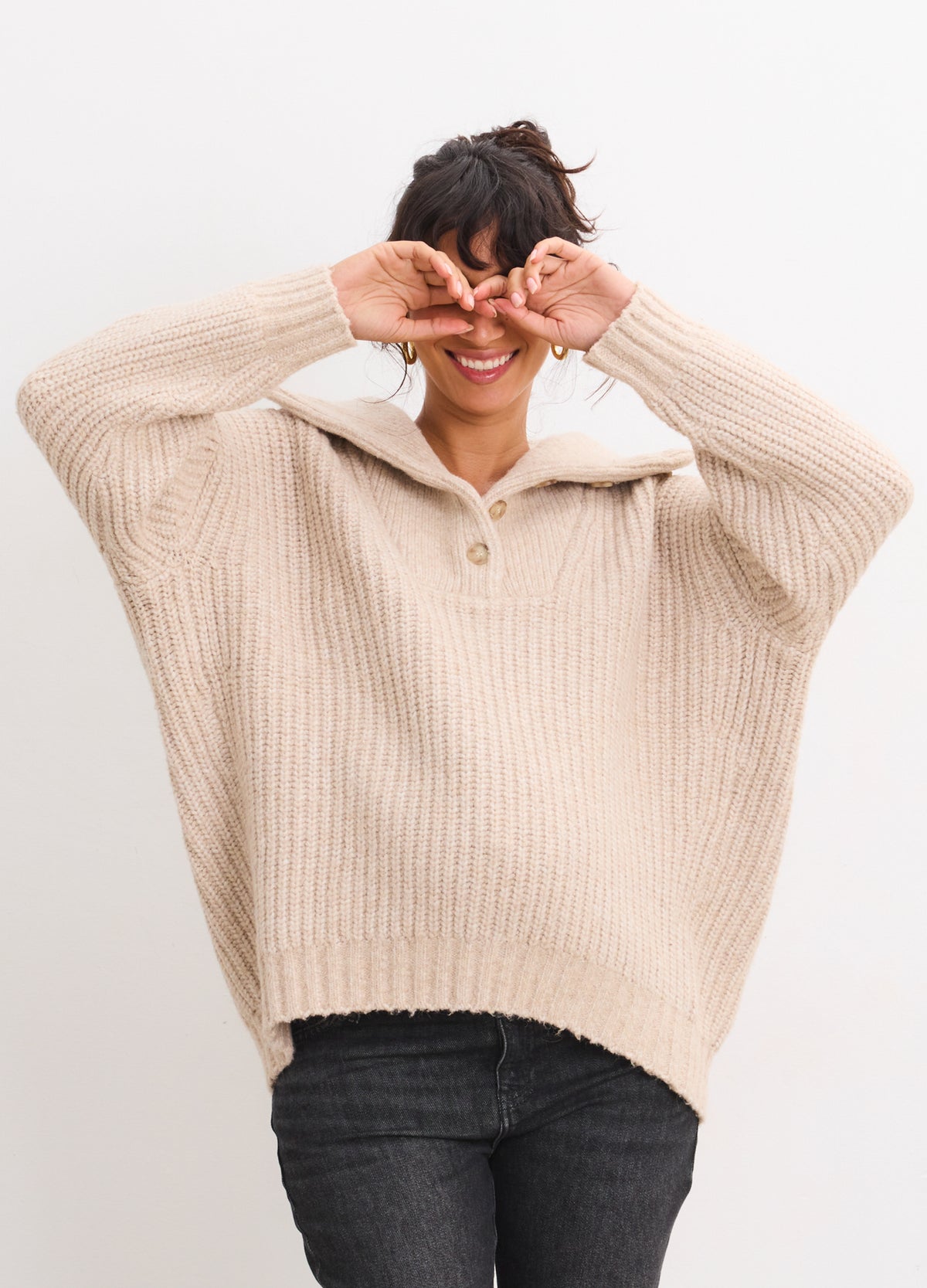 Oatmeal ribbed maternity sweater with half-button collar, relaxed fit on pregnant model.