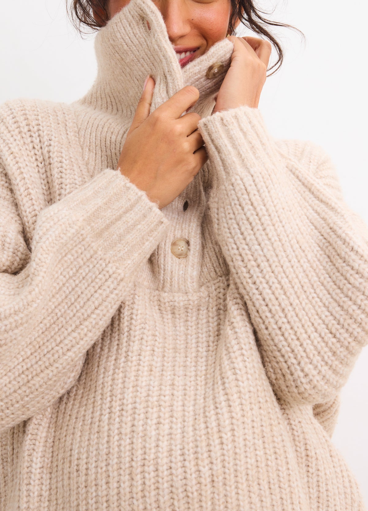 Oatmeal ribbed knit maternity sweater with high collar and button placket, designed for pregnant women.