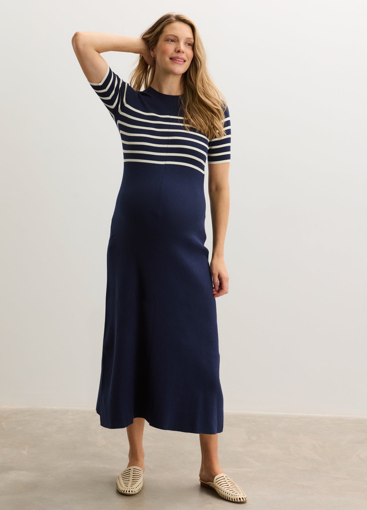 Navy and white striped short-sleeve ribbed cotton maternity dress with a fitted bodice and A-line skirt.