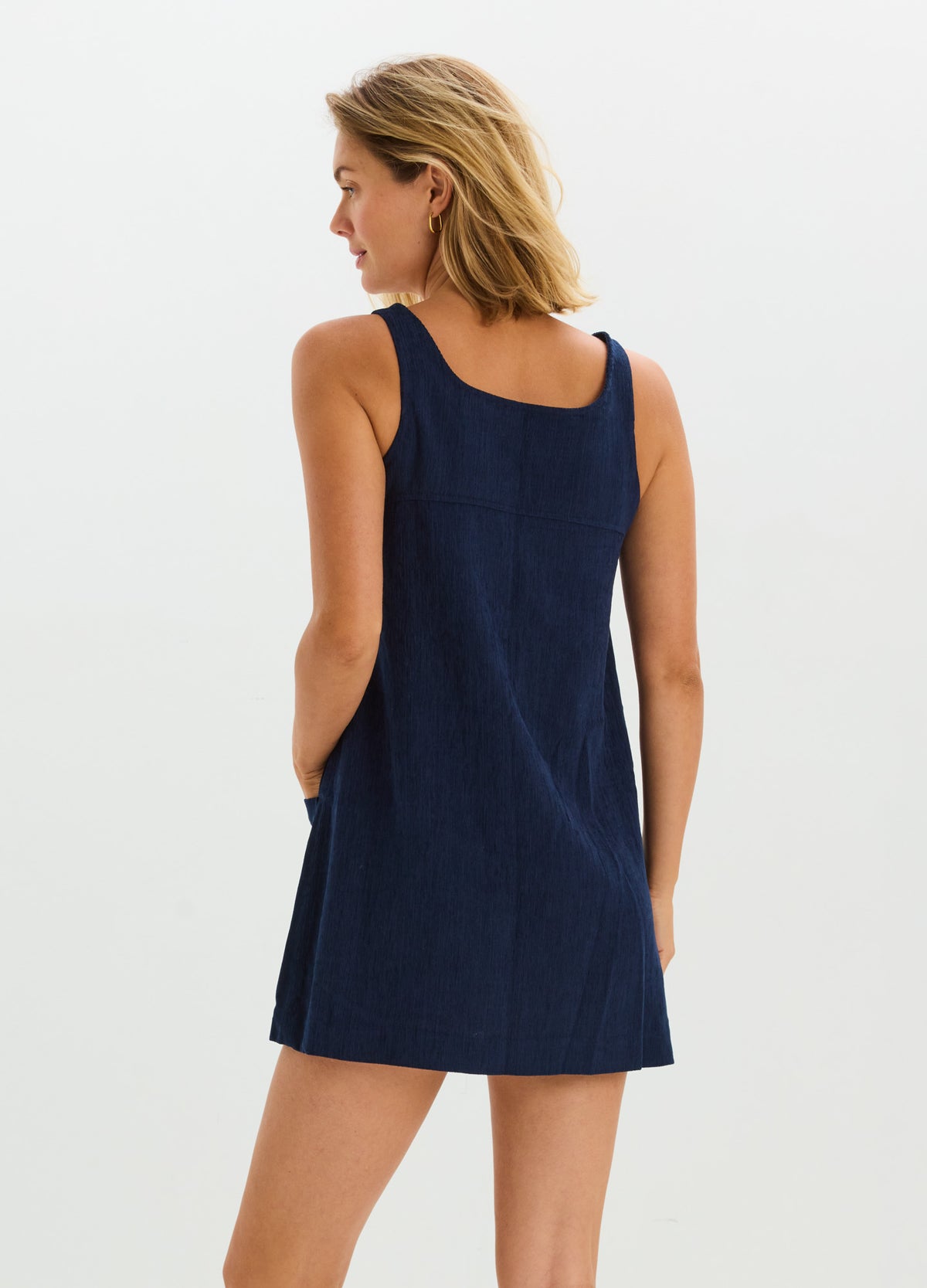 Navy blue corduroy sleeveless mini dress with a relaxed fit, designed for maternity wear.
