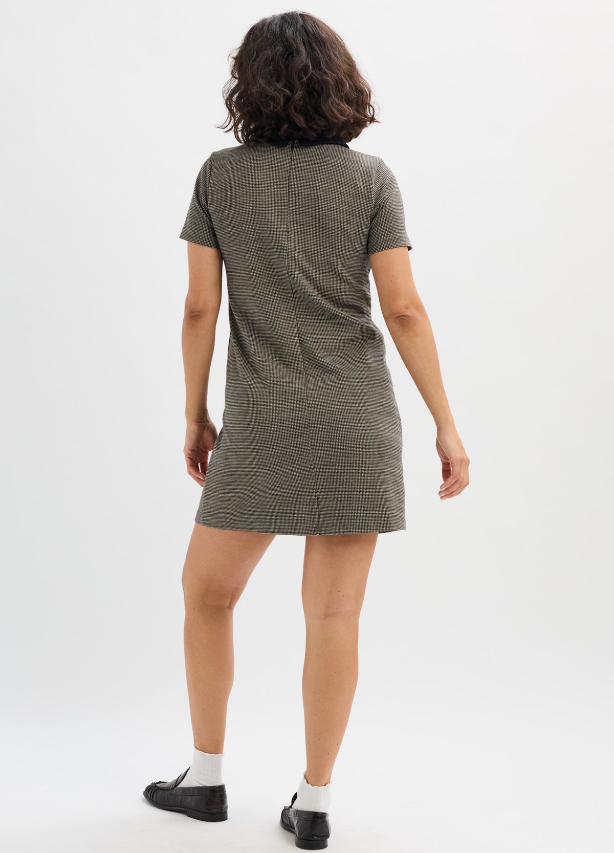 Olive green short-sleeve maternity mini dress with subtle pattern, soft stretchy fabric, relaxed fit.