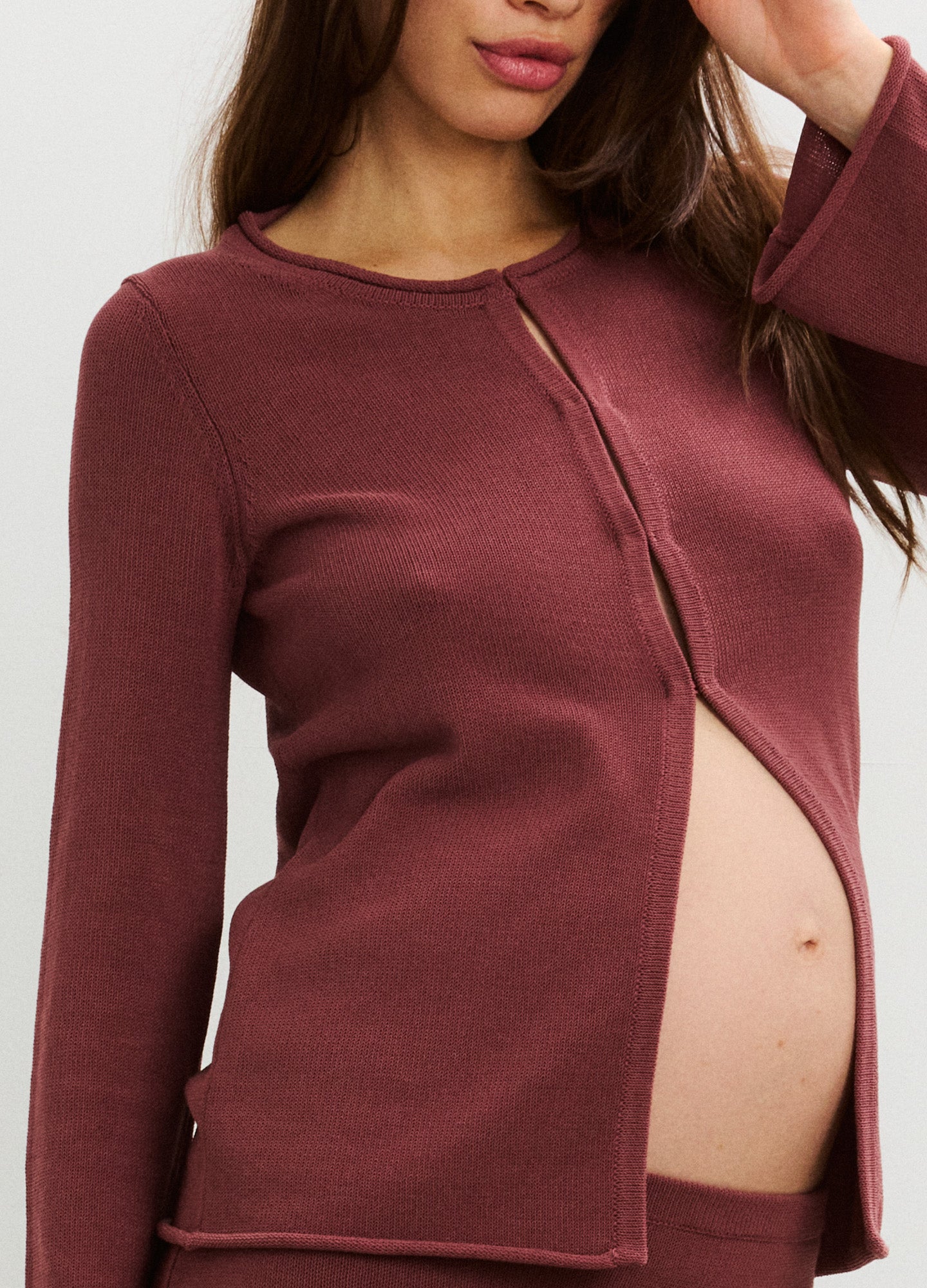 Soft mauve maternity top with long sleeves and front button closure, designed for nursing.