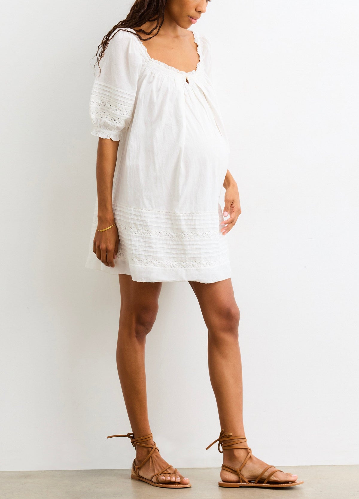 The Lottie Secret Nursing Mini Dress - White nursing mini dress with puff sleeves and delicate lace trim, designed for maternity and postpartum wear.