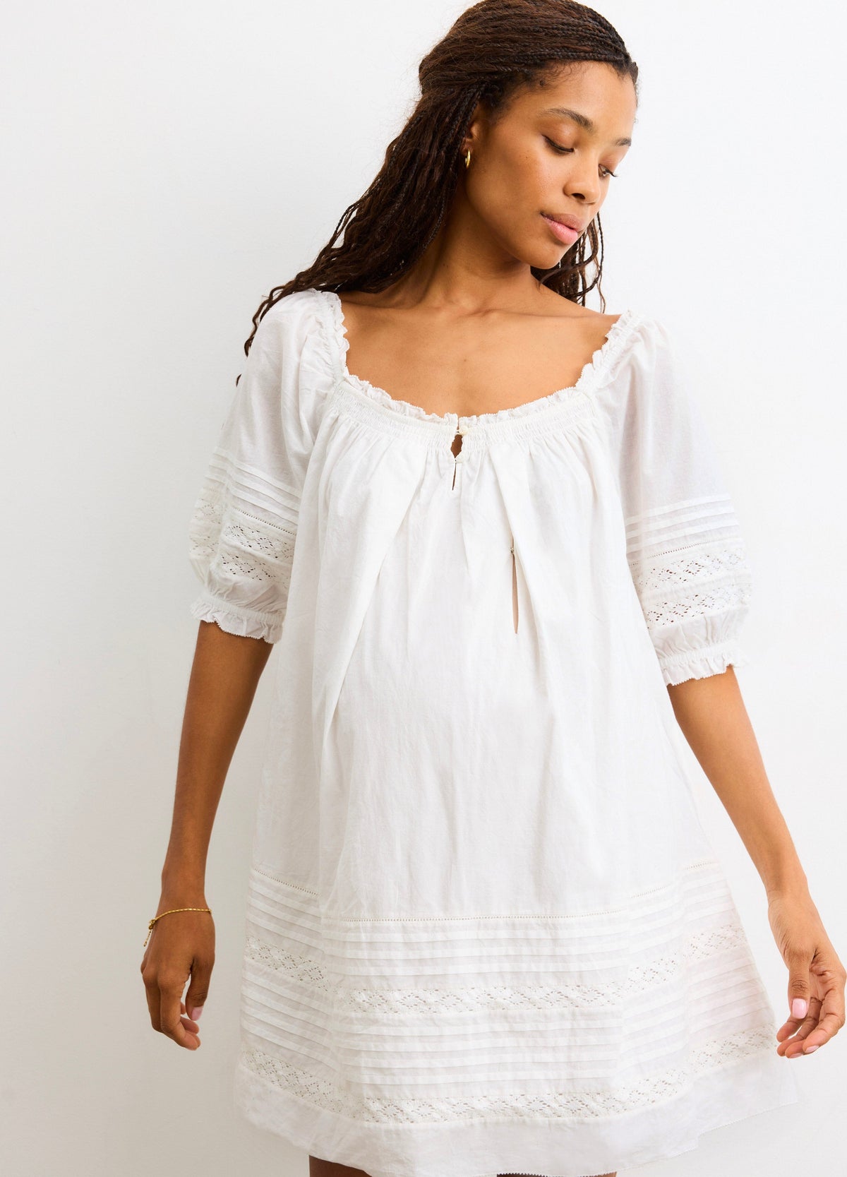 The Lottie Secret Nursing Mini Dress - White nursing mini dress with puff sleeves and delicate lace trim, designed for maternity and postpartum wear.