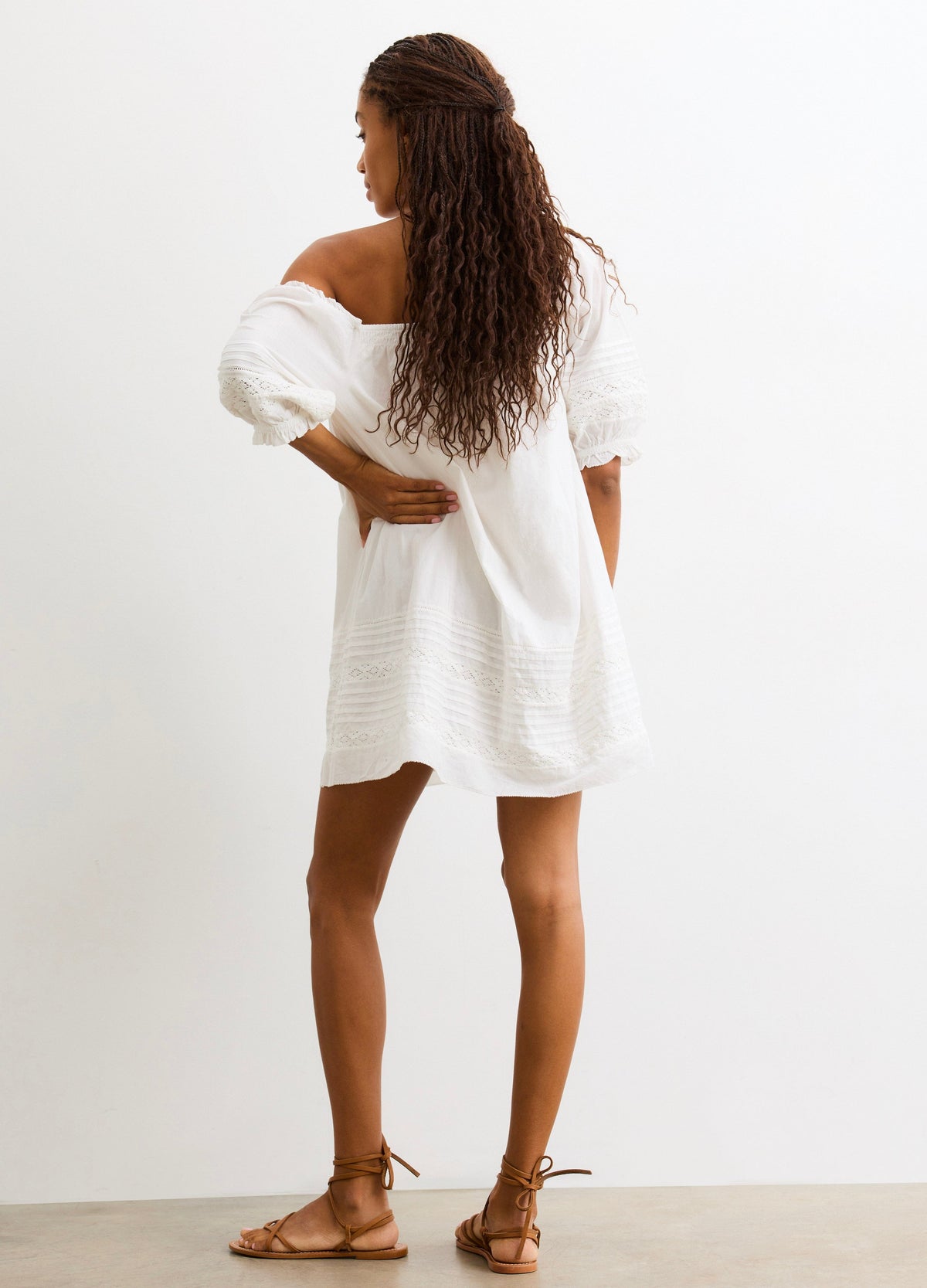 The Lottie Secret Nursing Mini Dress - White nursing mini dress with puff sleeves and delicate lace trim, designed for maternity and postpartum wear.