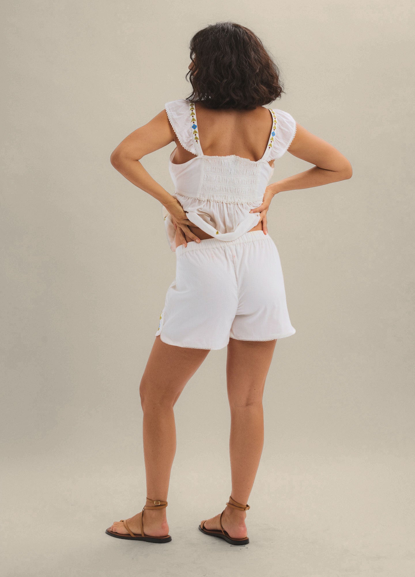 White maternity shorts with a relaxed fit and elastic waistband designed for pregnant women.