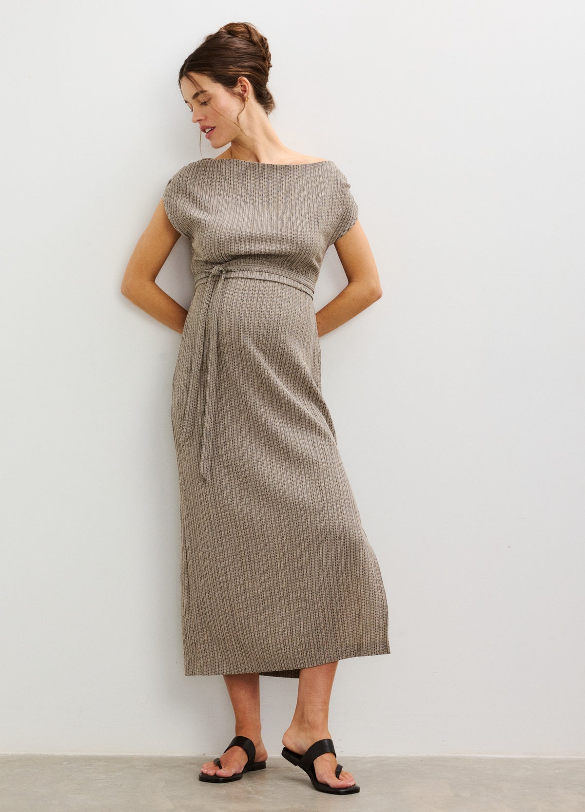 Taupe ribbed knit maternity dress with short sleeves, fitted waist tie, and midi length.