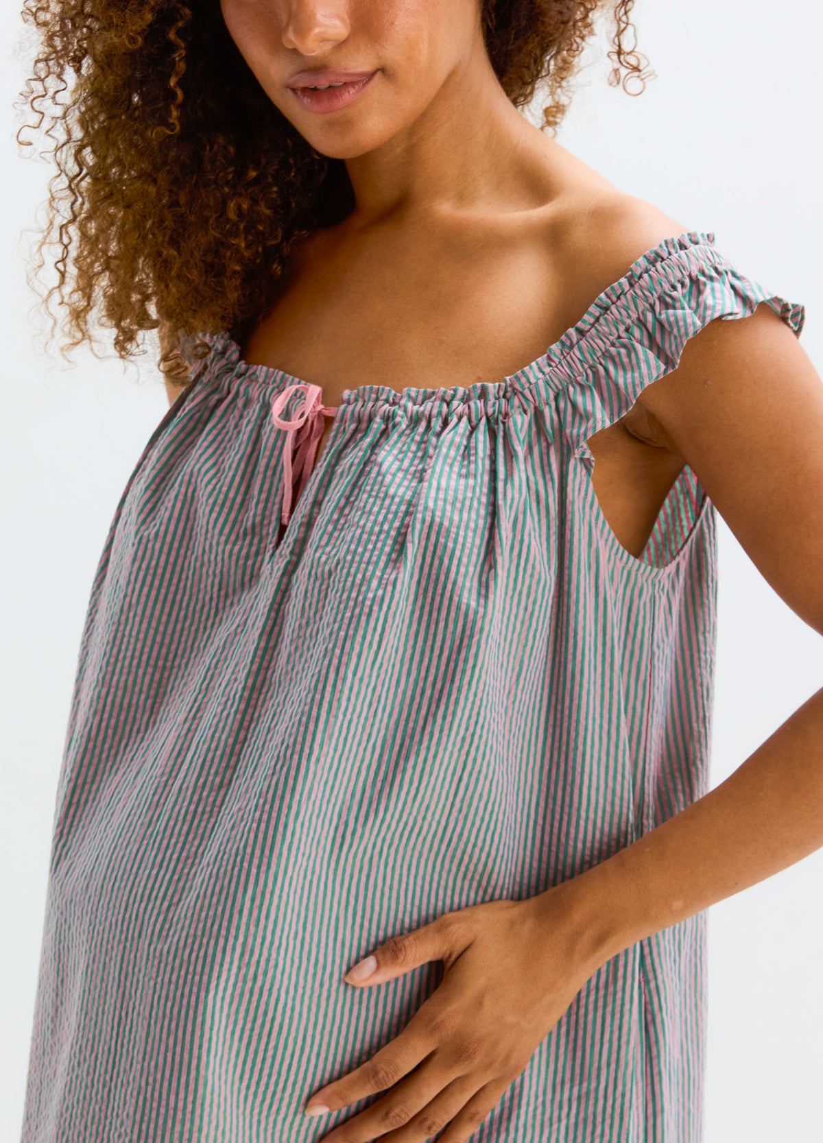 Striped nursing mini dress with ruched off-shoulder sleeves and a pink drawstring at the neckline.
