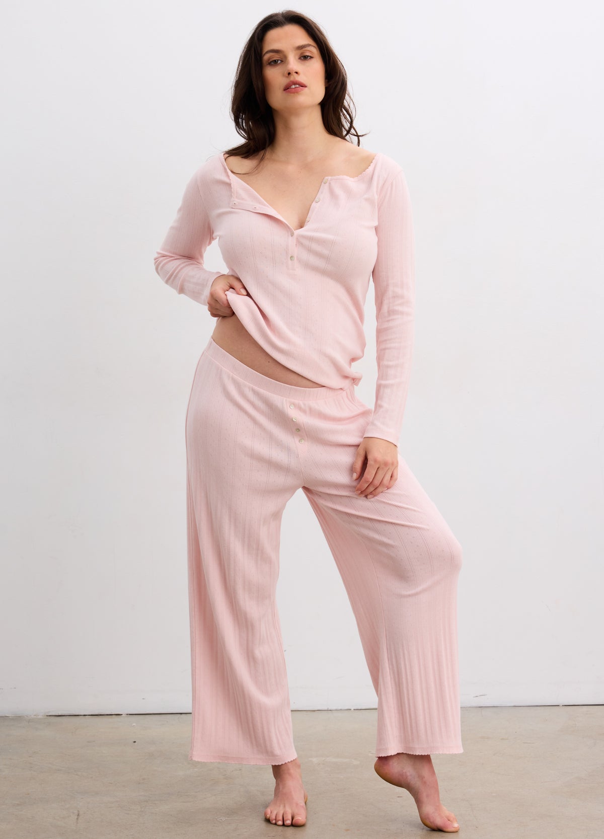 Soft pink maternity lounge pants with wide legs and comfortable stretchy waistband for pregnant women.