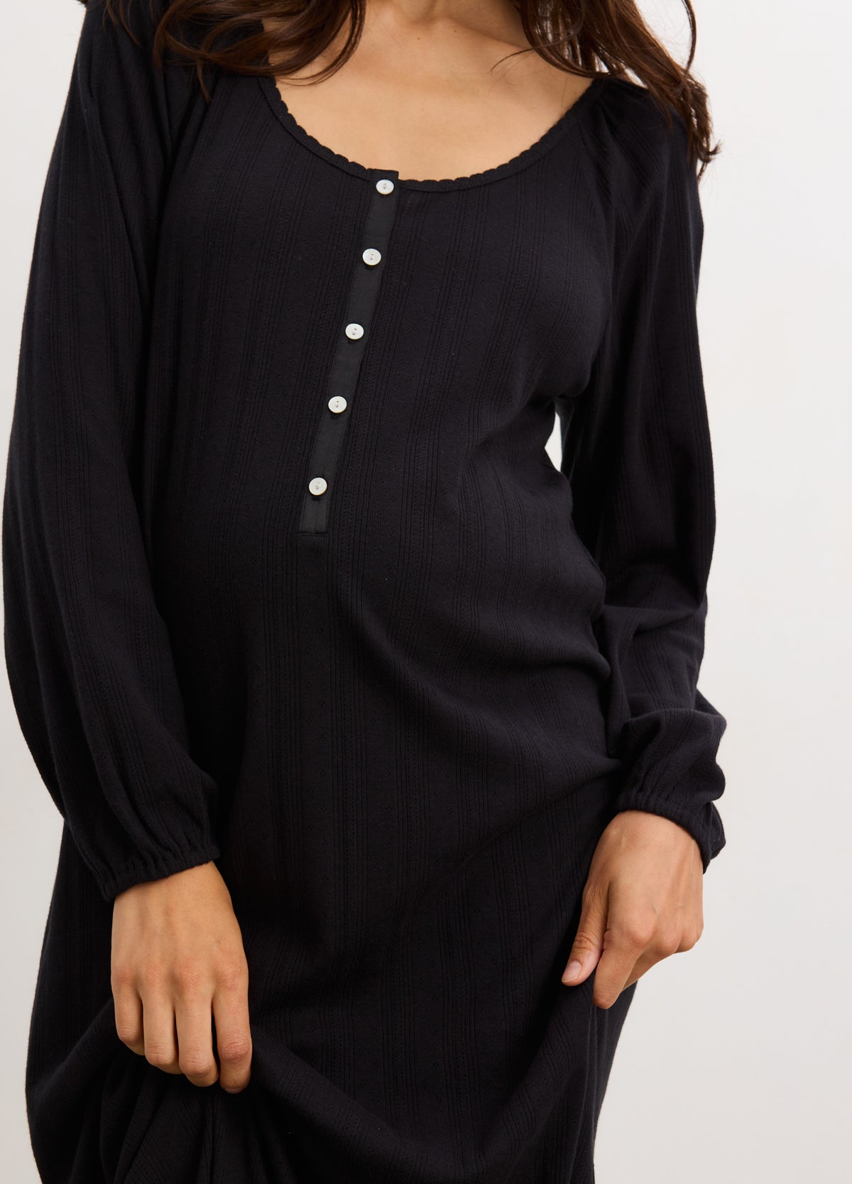 Black long sleeve maternity nightgown with buttoned front and soft ribbed fabric.