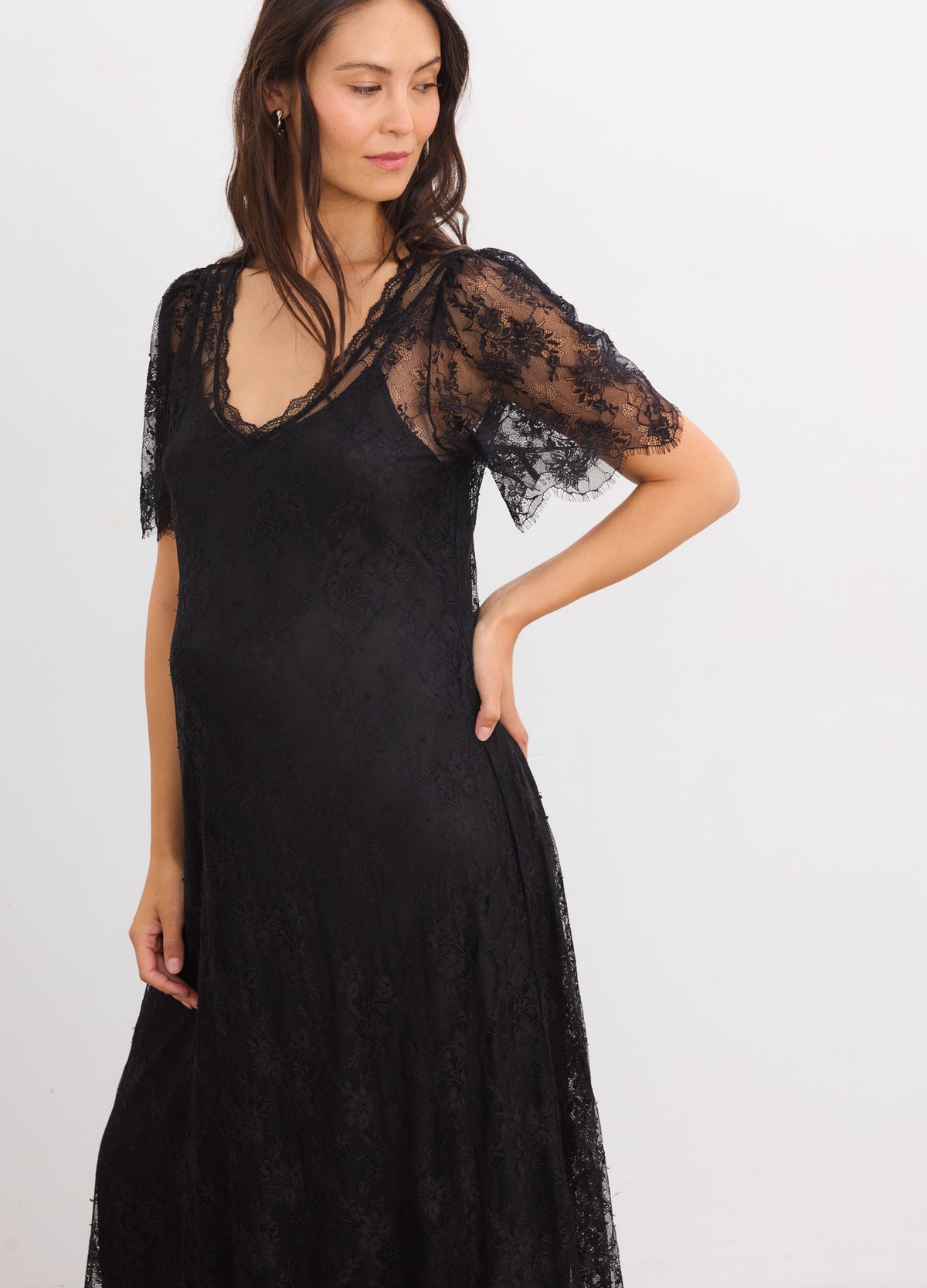 Black lace maternity dress with V-neckline and sheer short sleeves for pregnant women.