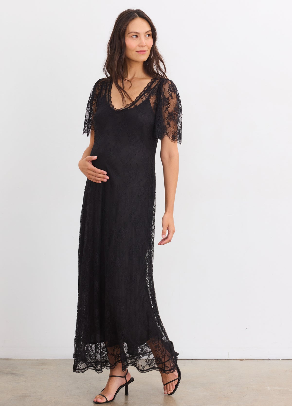 Black lace maternity dress with V-neck and short sleeves, designed for pregnant women.