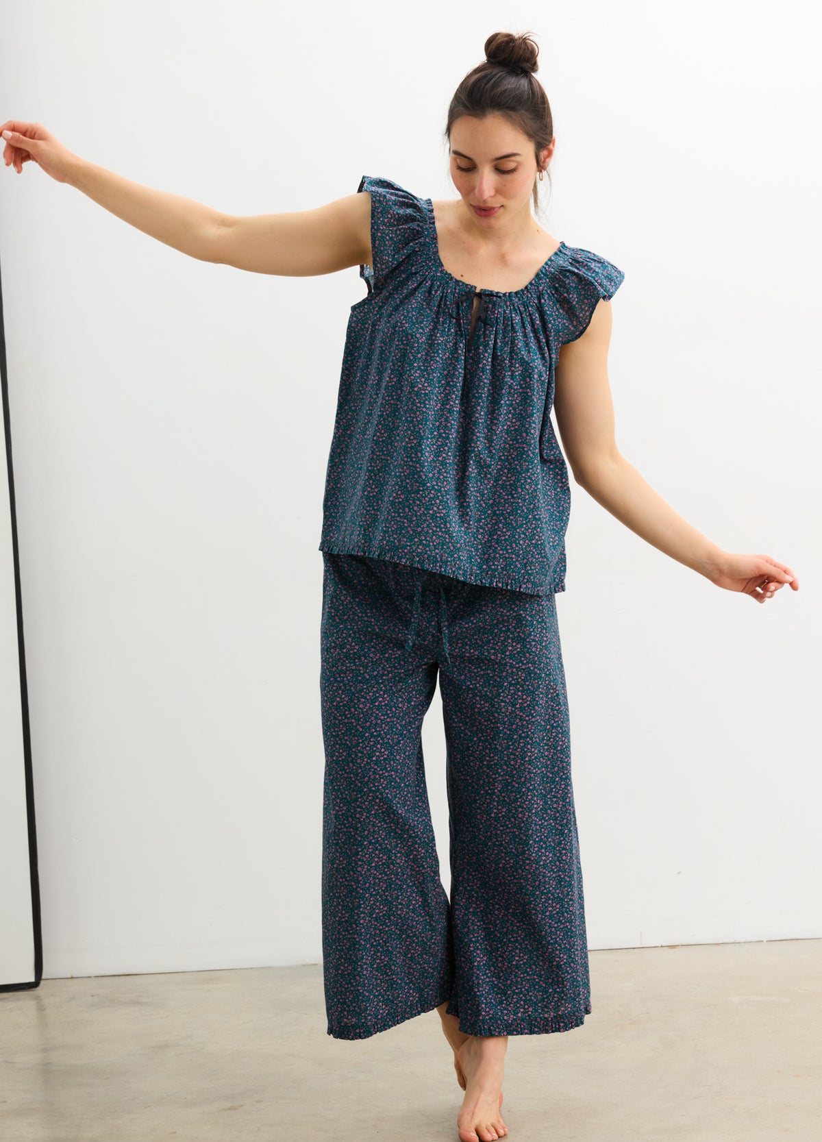 Maternity pajama set with ruffle tank top and wide-leg pants in blue floral print, designed for pregnant comfort.