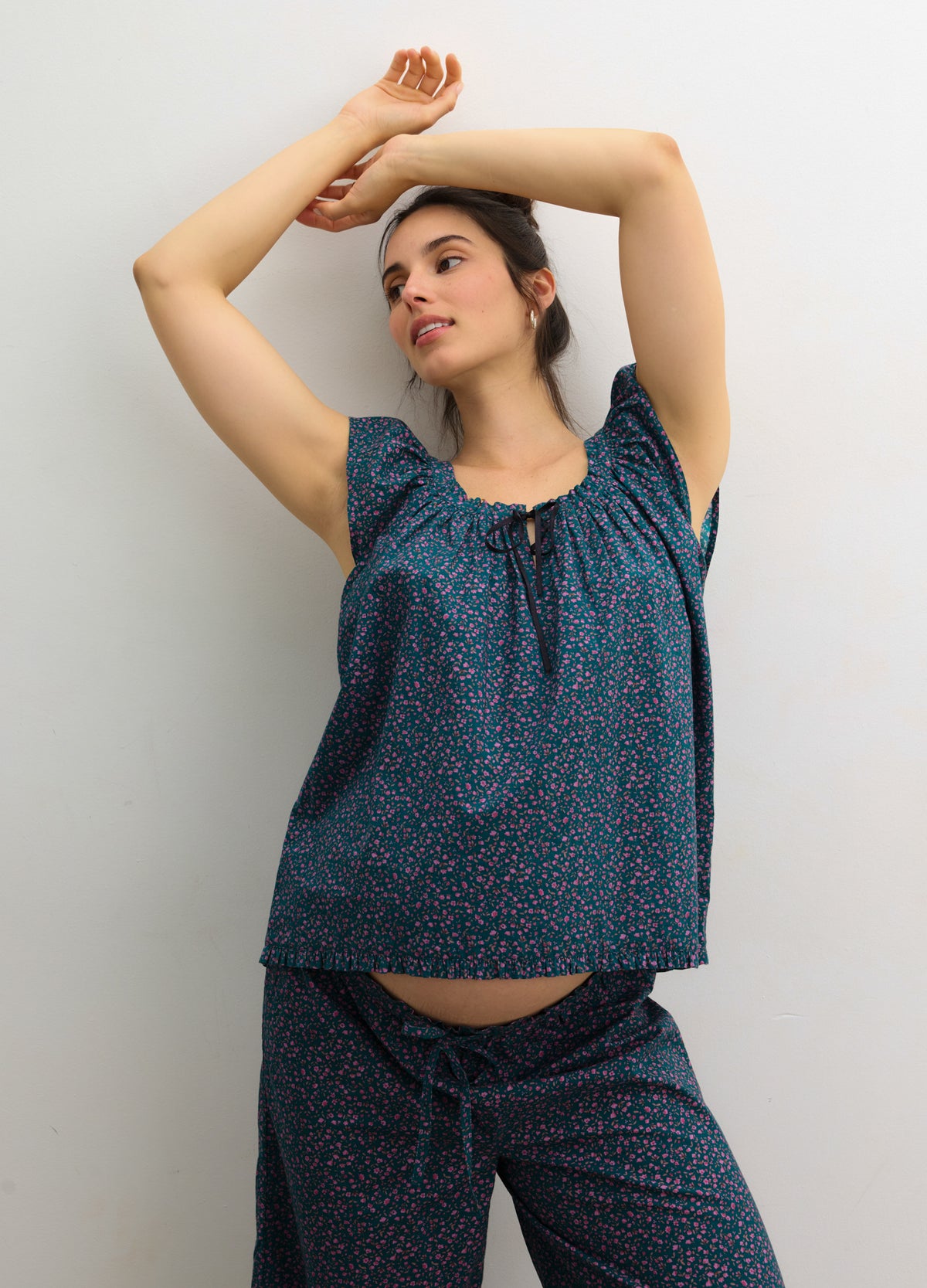 Navy blue maternity tank top and pants set with subtle floral print and ruffled cap sleeves.