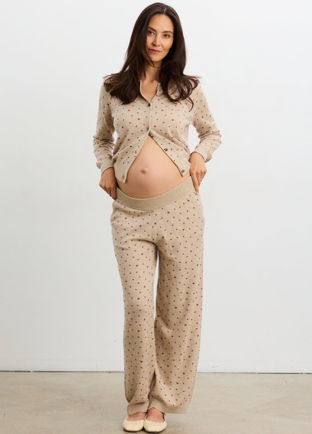 Maternity knit pants in oat melange with floral print, stretchy waistband for pregnant comfort.