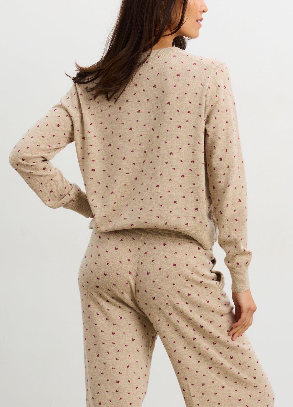 Light beige knit maternity cardigan with small floral pattern, designed for pregnant women.