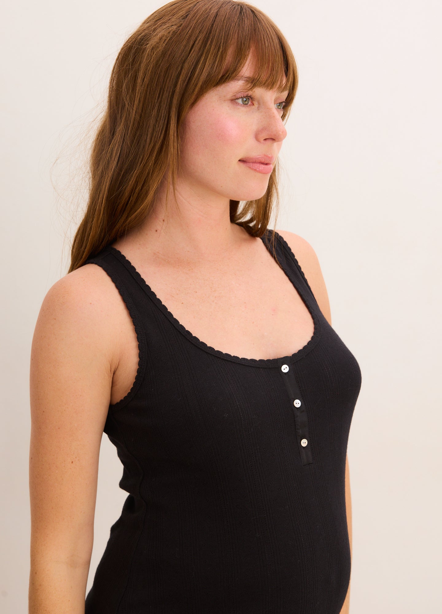 Black sleeveless maternity nightie with buttoned scoop neckline and soft, stretchy fabric.