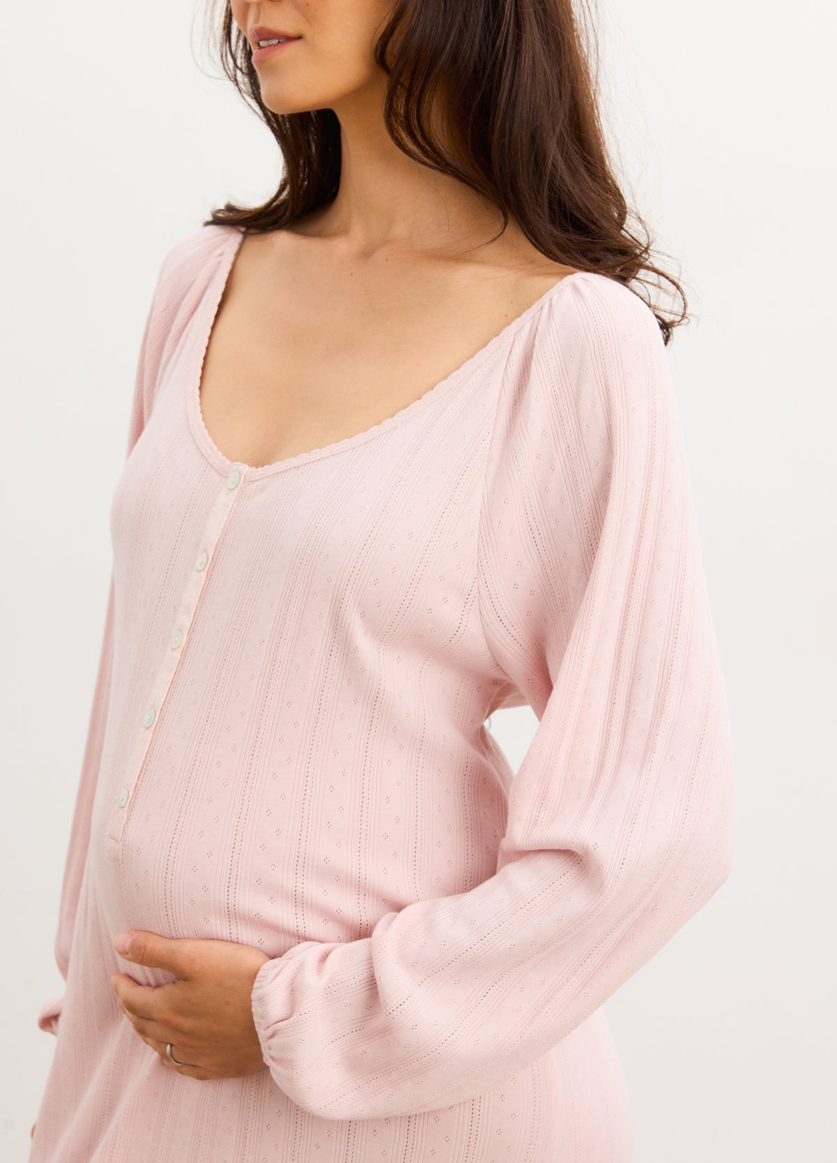 Soft pink pointelle knit long sleeve nightgown with scoop neckline and relaxed fit.