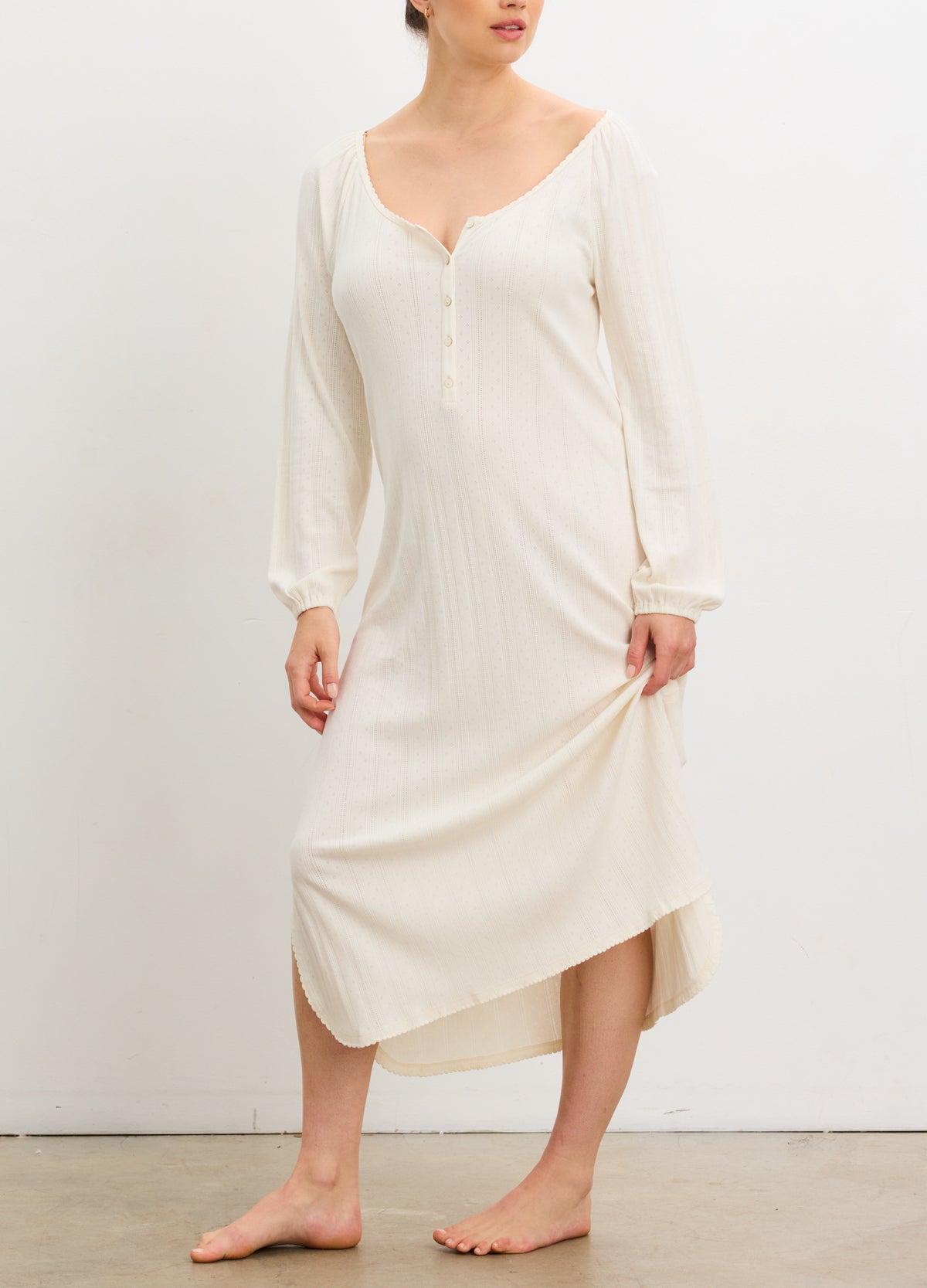 Ivory long sleeve maternity nightgown with pointelle knit, scoop neck, and button front, styled for pregnant women.