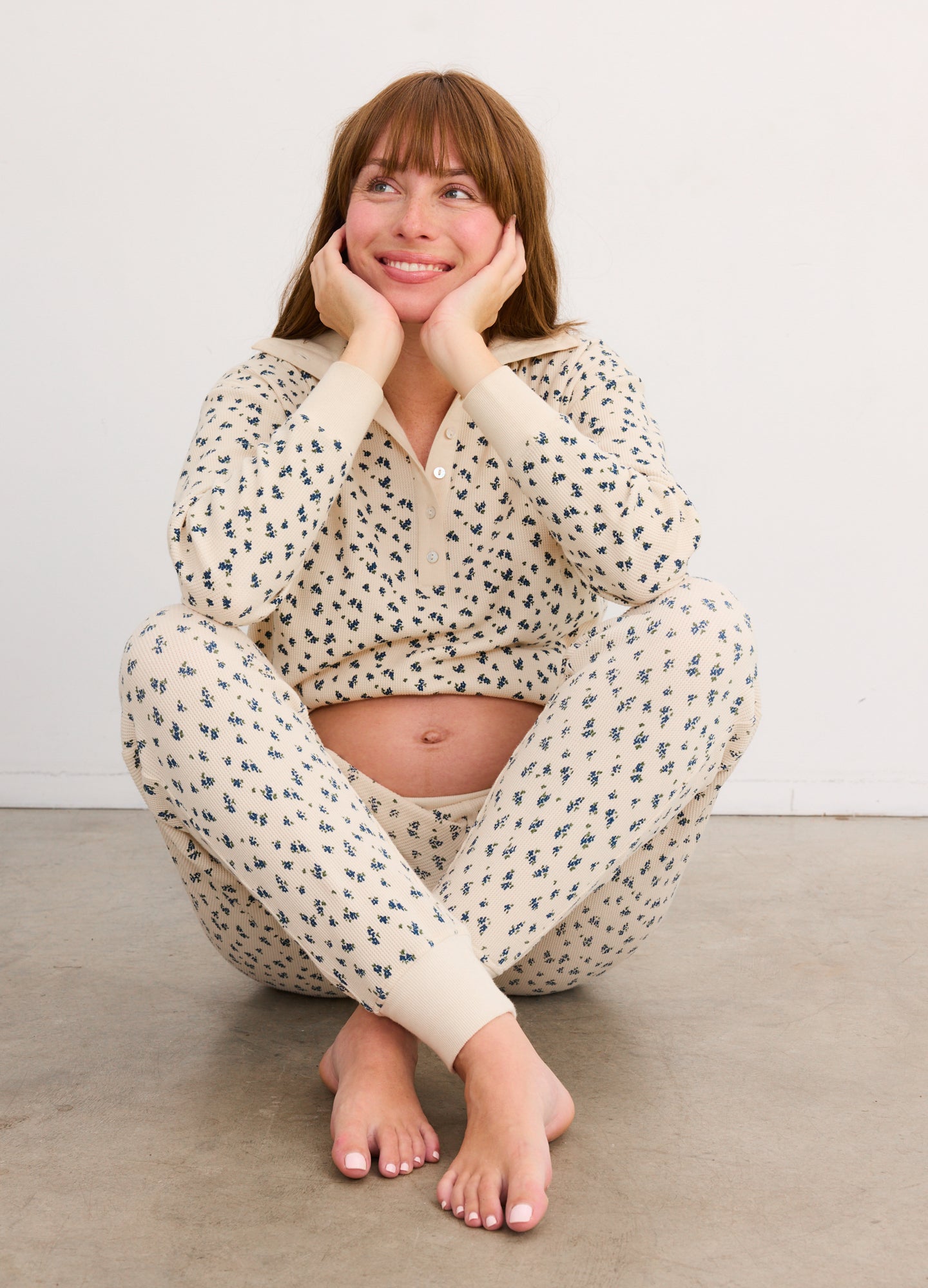 Cream waffle knit joggers and matching long-sleeve top with black leopard print, maternity fit.