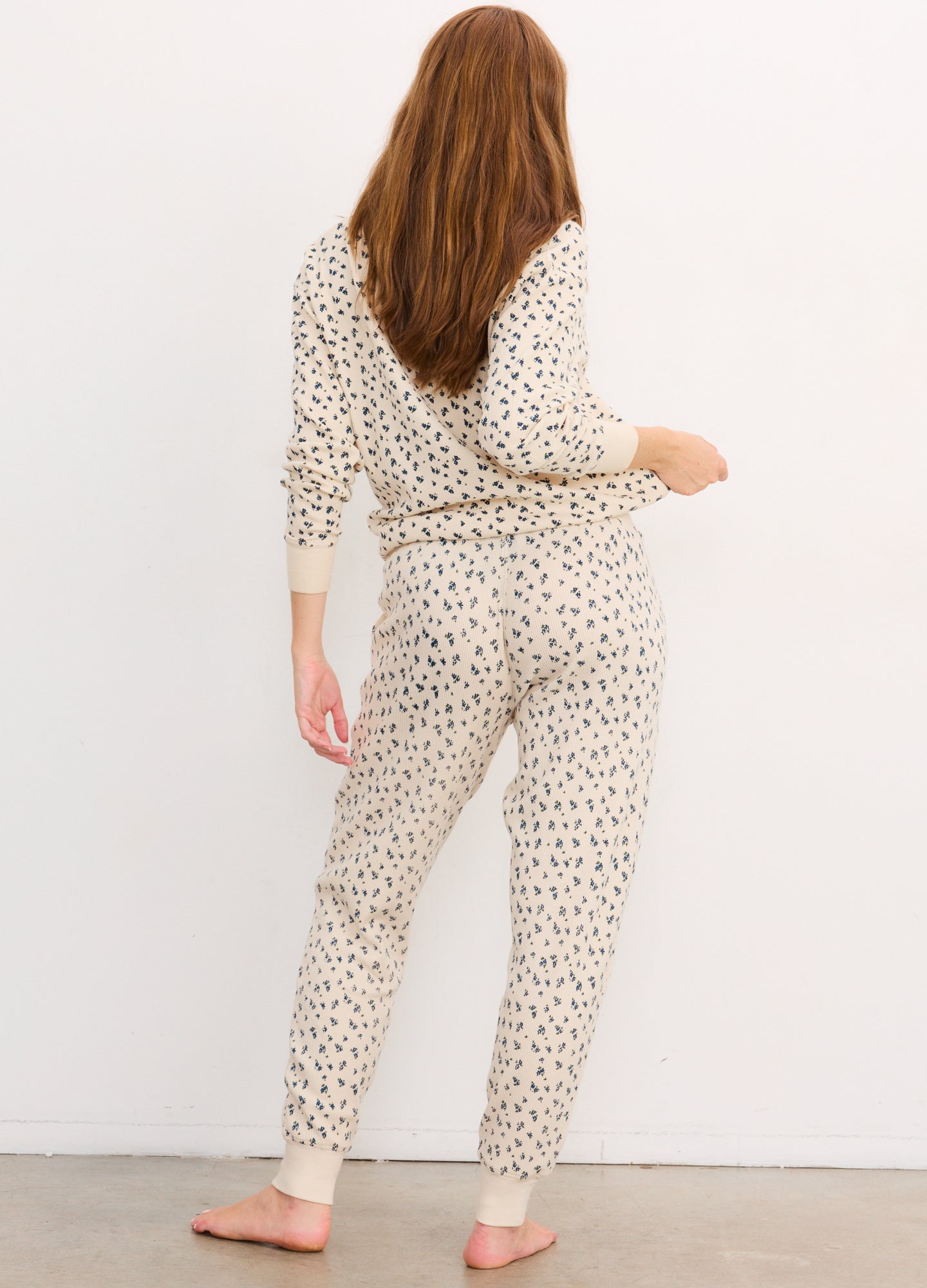 Cream-colored waffle knit maternity pullover with brown leopard print, long sleeves, relaxed fit.