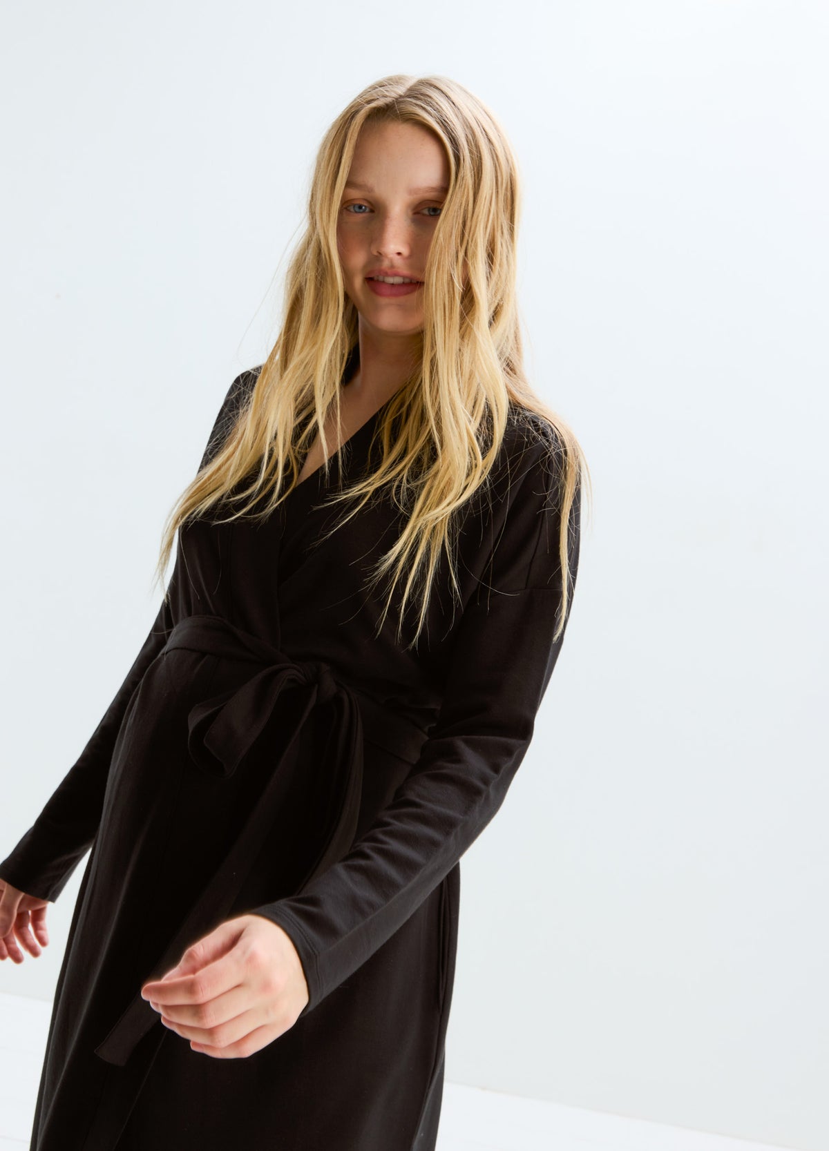 Black long-sleeve maternity robe with tie waist, soft fabric, designed for postpartum comfort.