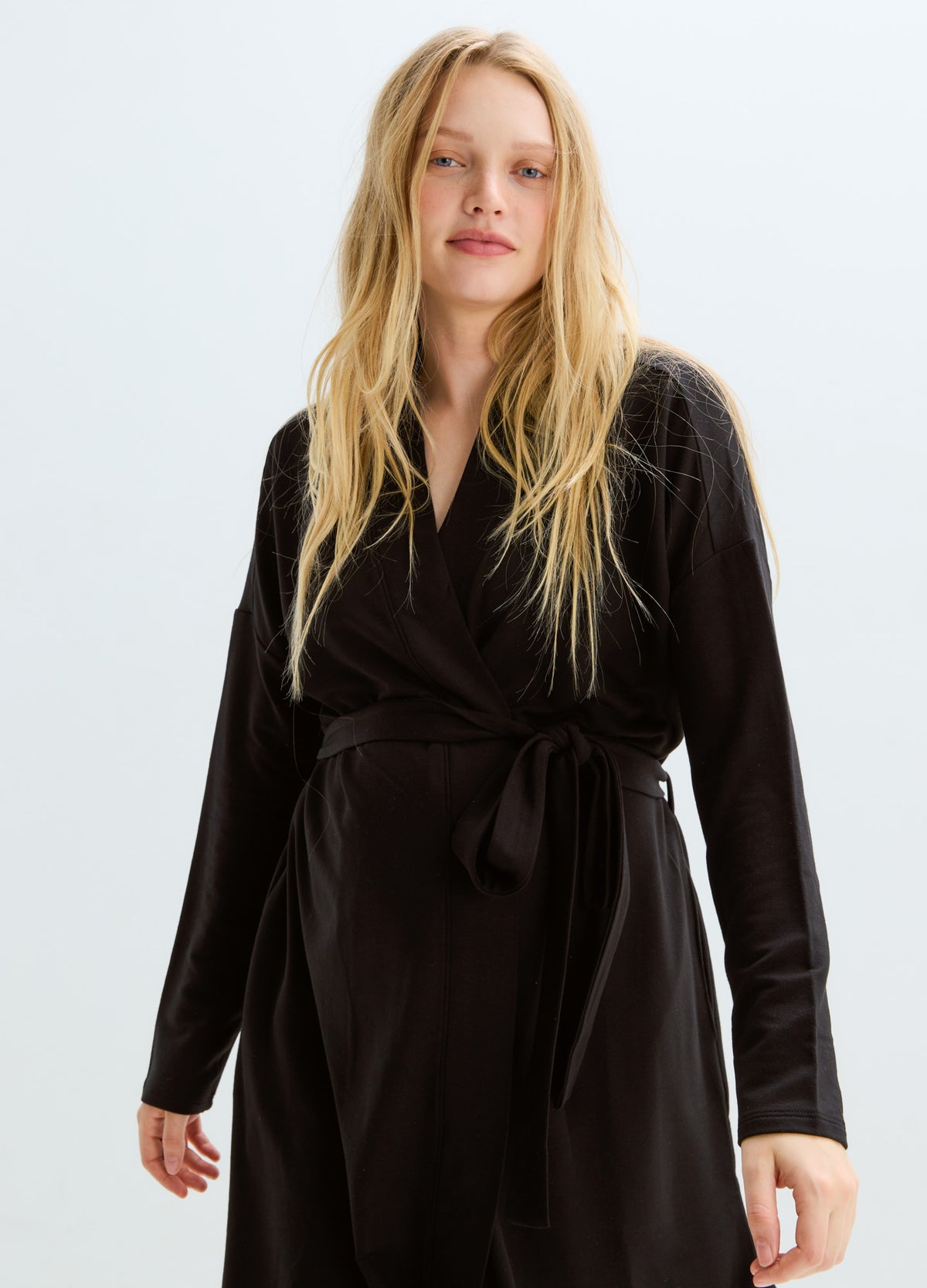 Black long-sleeve maternity robe with a waist tie and soft, cozy fabric.