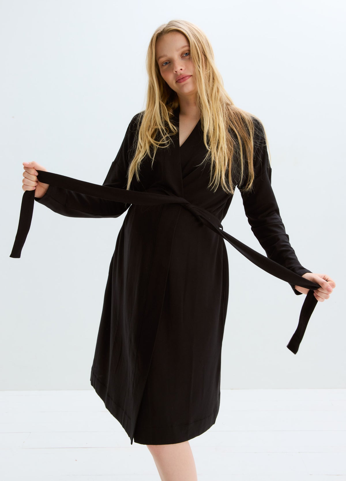 Black knee-length maternity robe with long sleeves and waist tie belt.