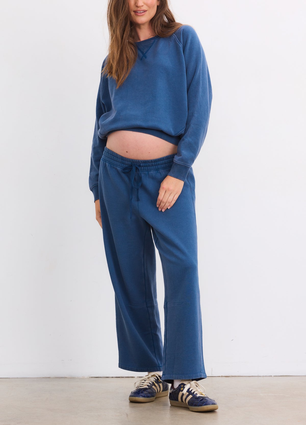 Blue maternity sweatpants with a relaxed fit, drawstring waist, and soft fabric.