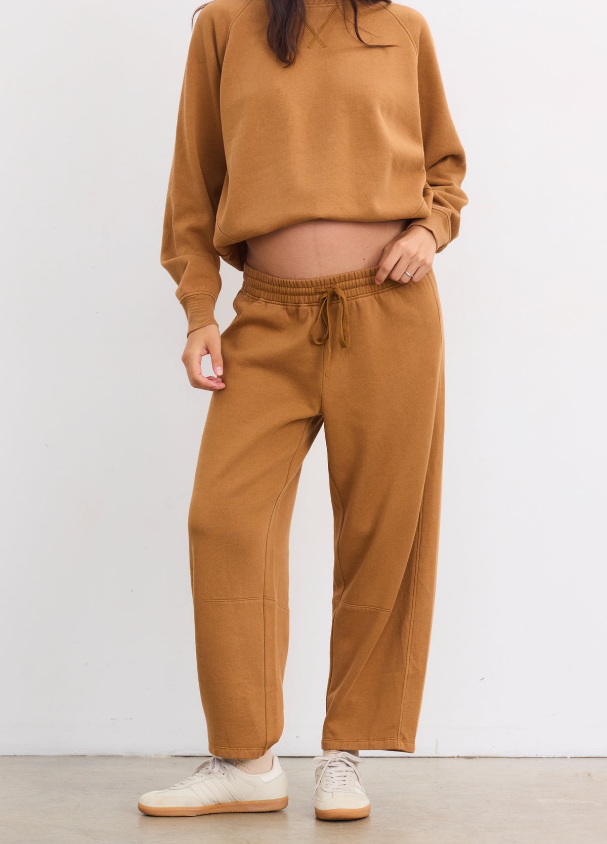Maternity rubber-colored Romy darted sweatpants with drawstring waist worn by pregnant model.