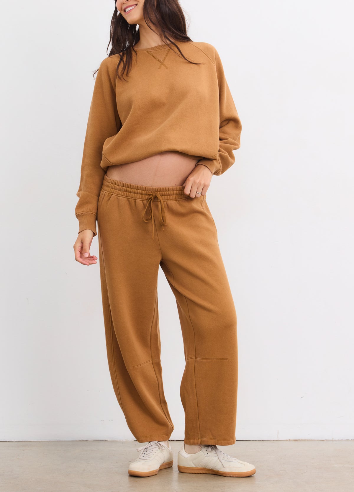 Camel brown maternity sweatshirt and matching sweatpants with relaxed fit and drawstring waist.