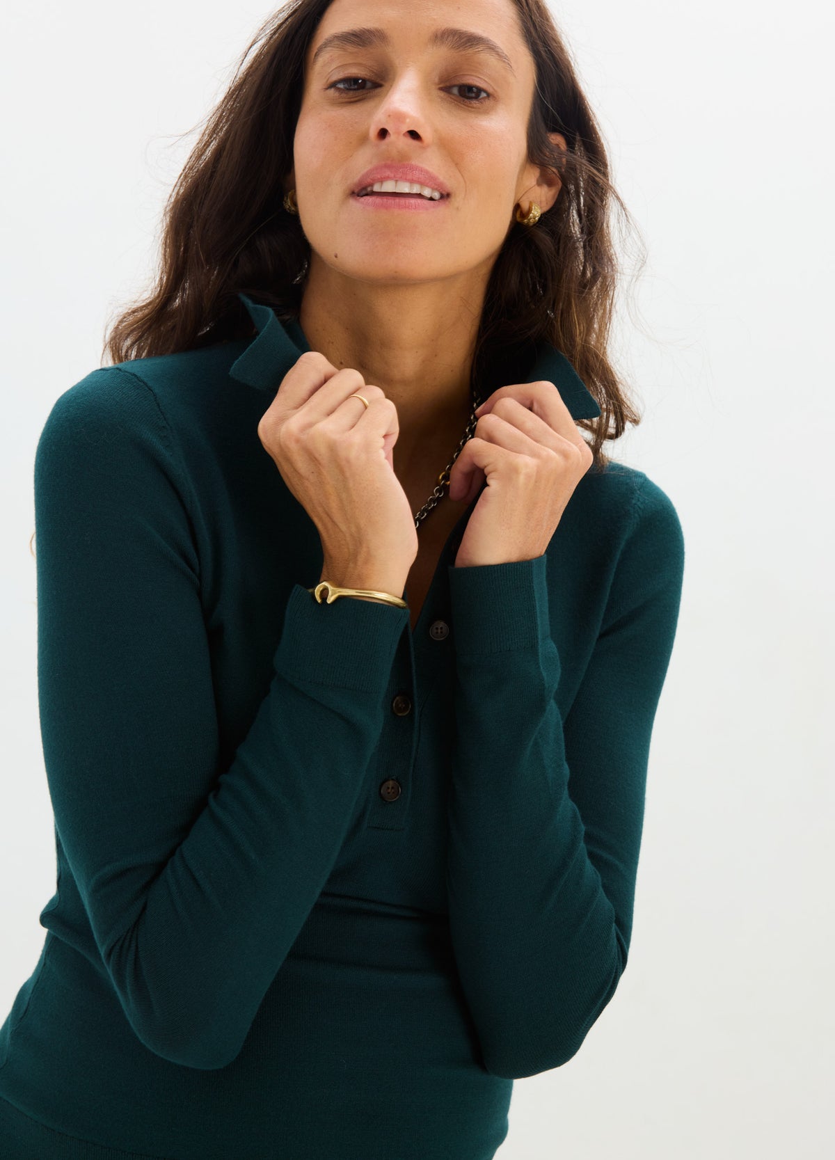 Dark green fitted knit nursing polo with long sleeves and button-up front designed for maternity wear.