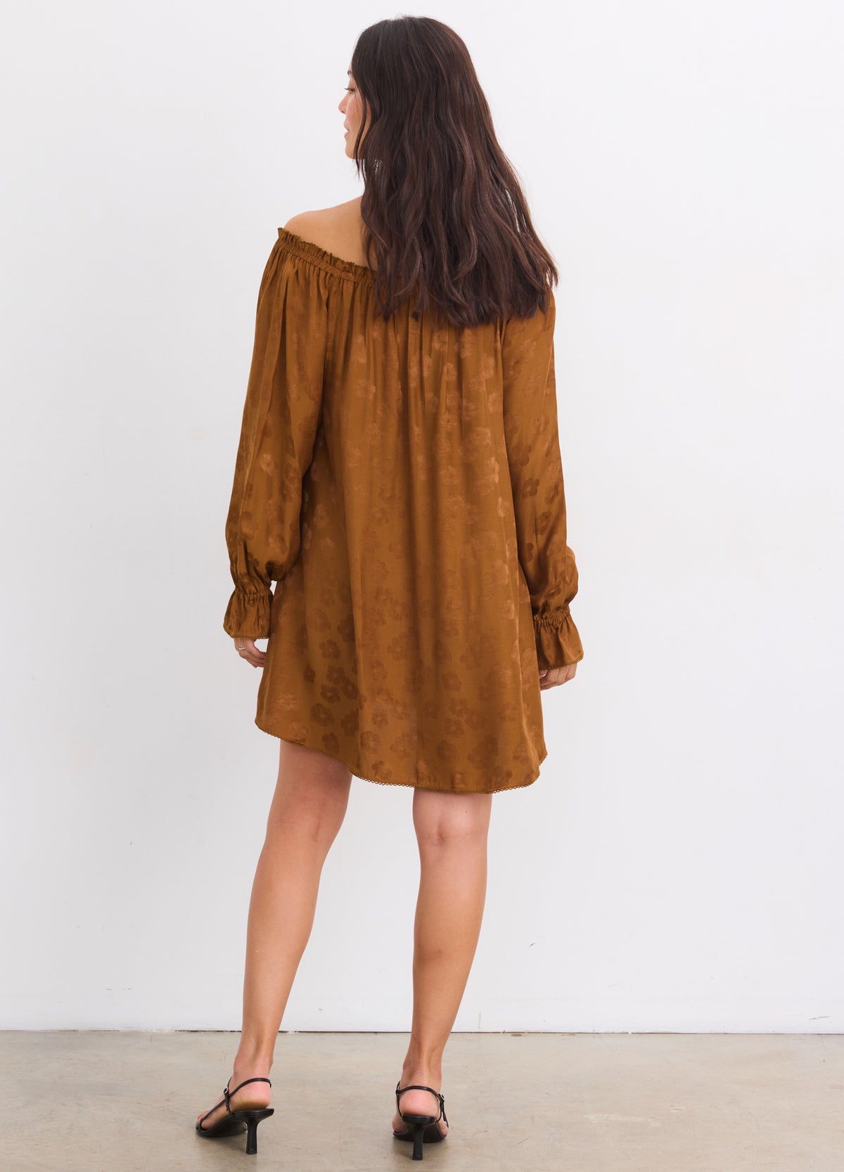 Brown off-the-shoulder jacquard mini dress with long sleeves, loose fit for maternity wear.