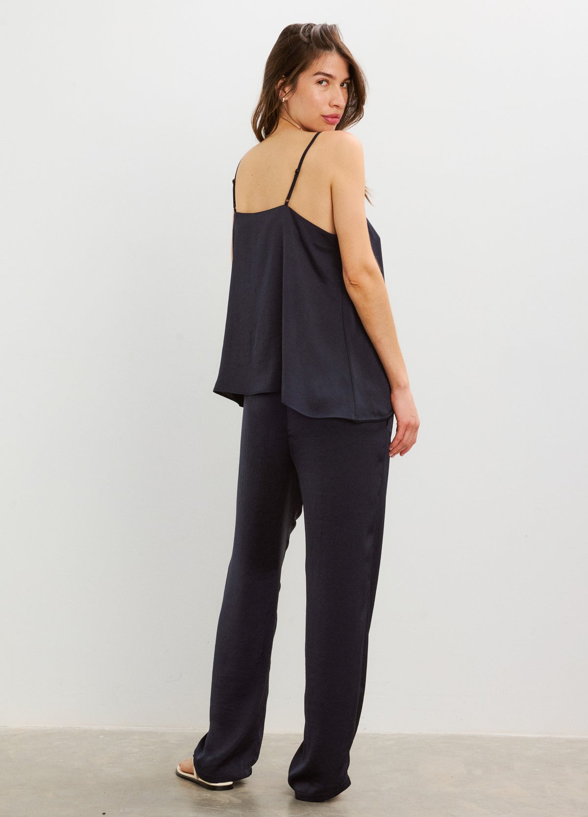 Black satin maternity pants with a relaxed fit and stretchy waistband for pregnant women.