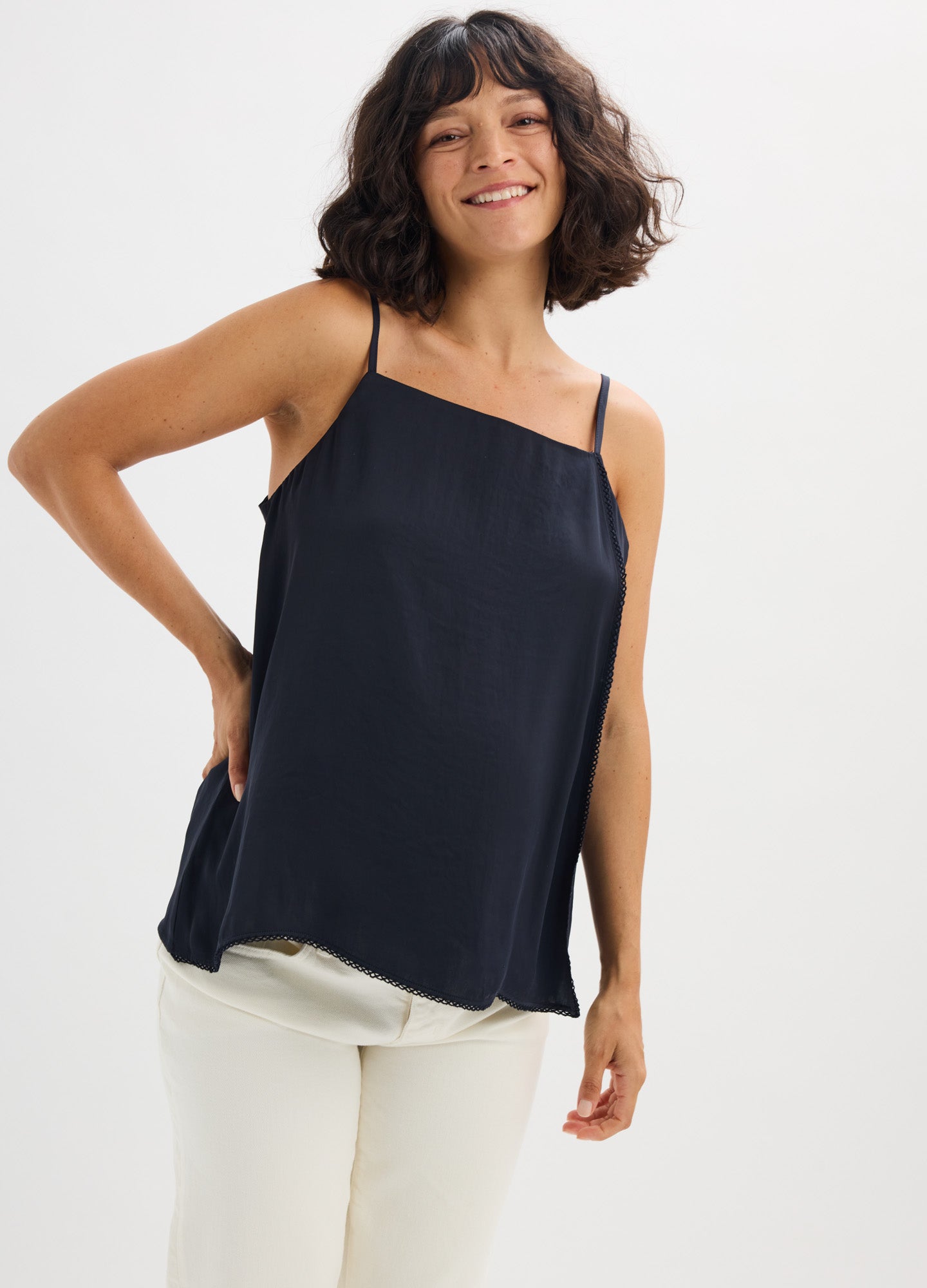 Black satin camisole with thin adjustable straps, loose fit ideal for maternity wear.