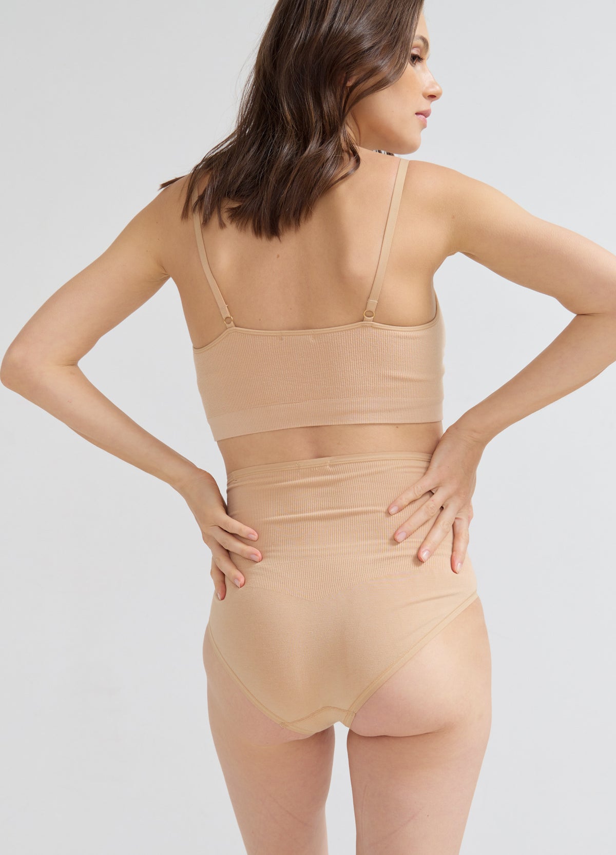 The Seamless Belly Brief - Seamless sand-colored maternity brief with full belly coverage for pregnancy and postpartum comfort.