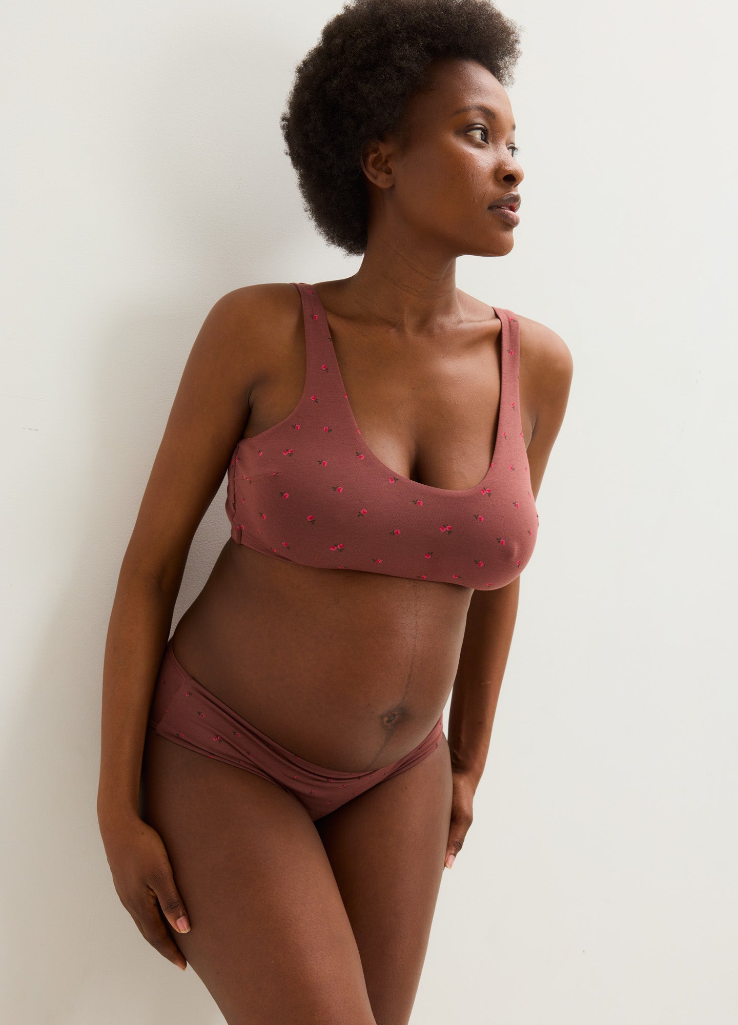 Dusty rose seamless maternity bra with wide straps and soft, stretchy fabric designed for pregnancy comfort.
