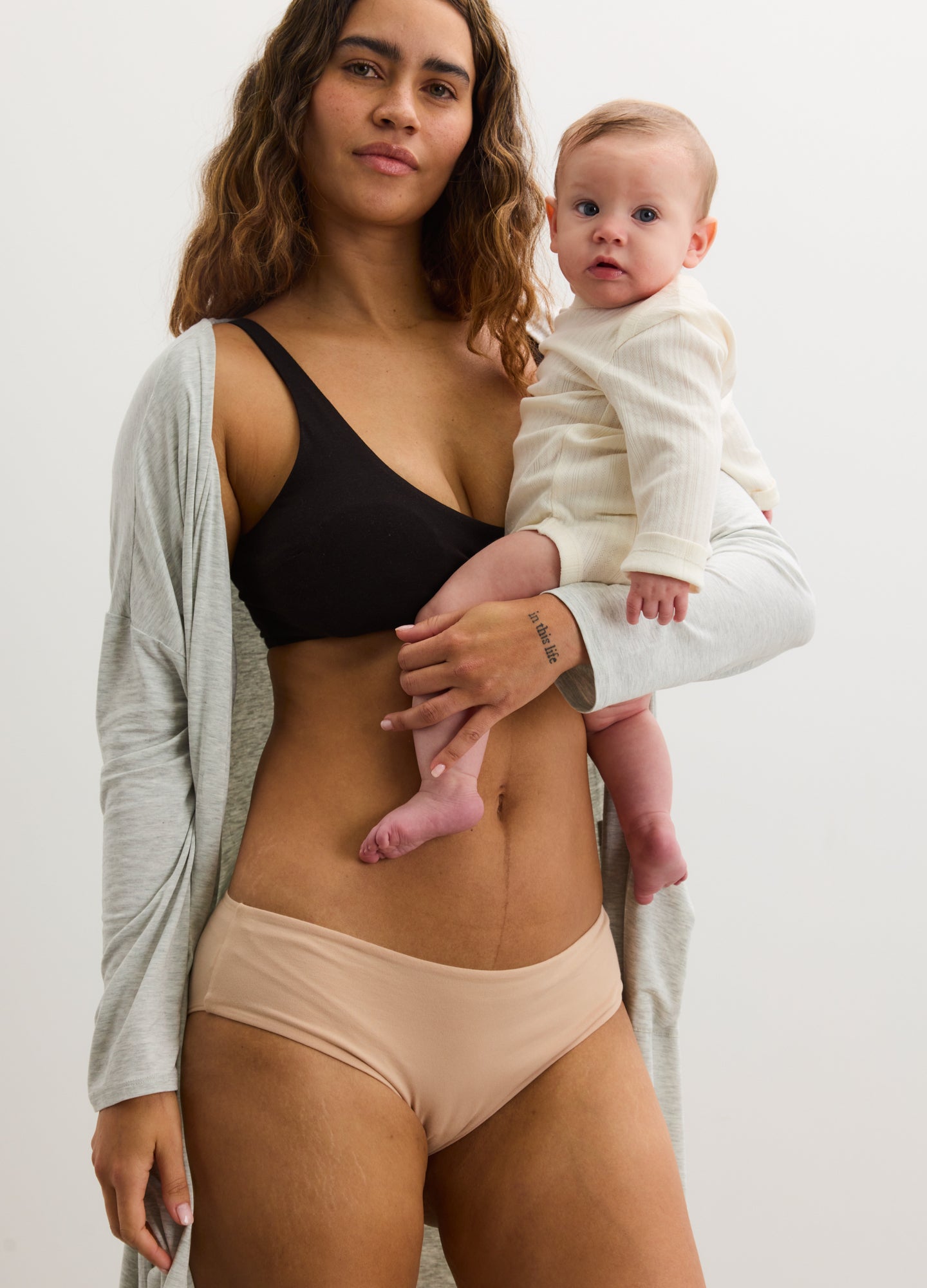 Black maternity nursing bra with wide straps and soft supportive fabric.