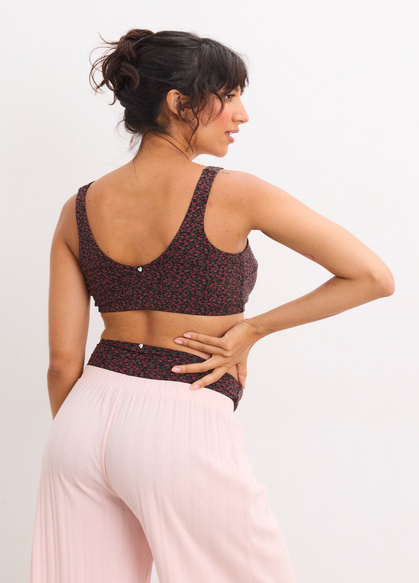 Brown maternity bra with adjustable straps and subtle dot pattern on stretchy fabric.