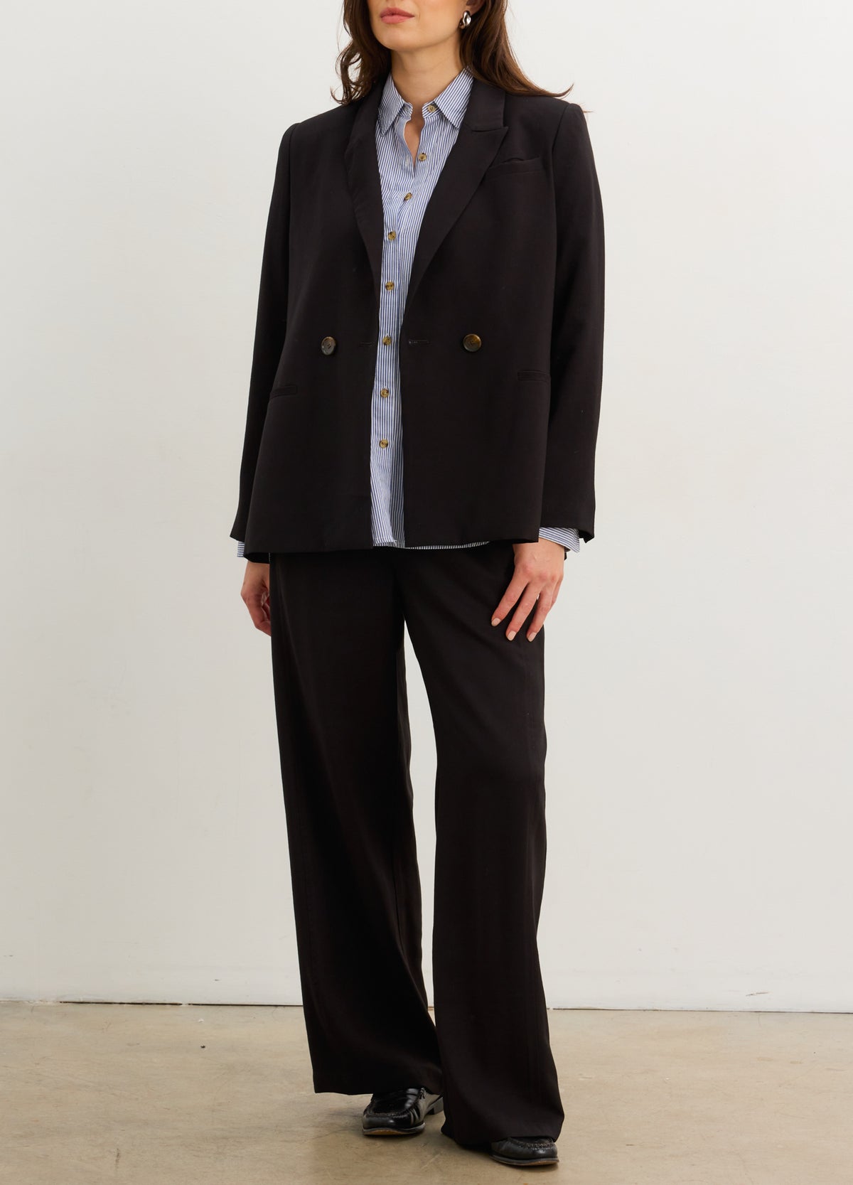 The Soft Tailored Twill Blazer - Black tailored twill blazer with double-button closure, designed for maternity, nursing, and postpartum wear.