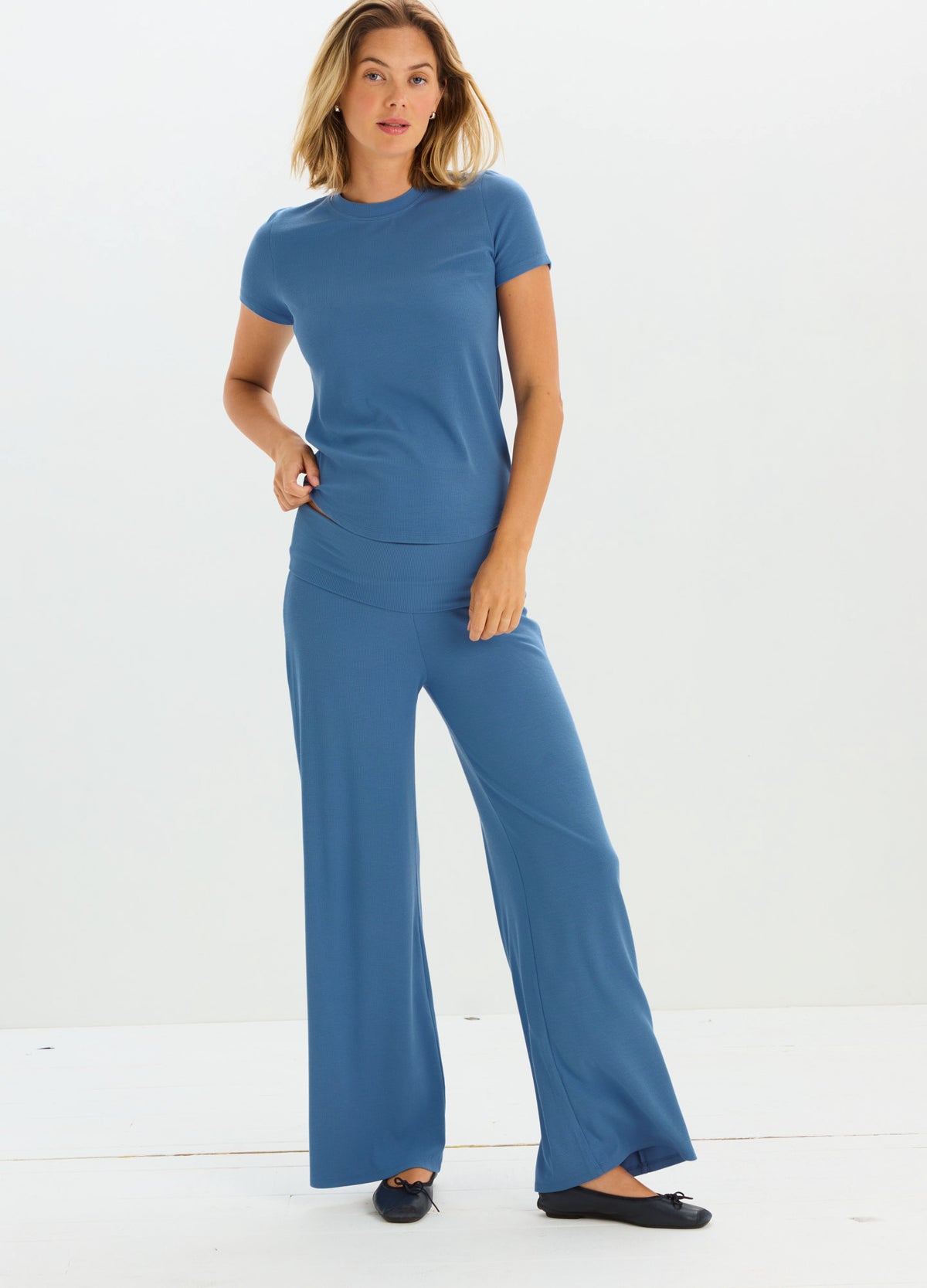 Blue ribbed short-sleeve maternity tee paired with matching wide-leg pants.