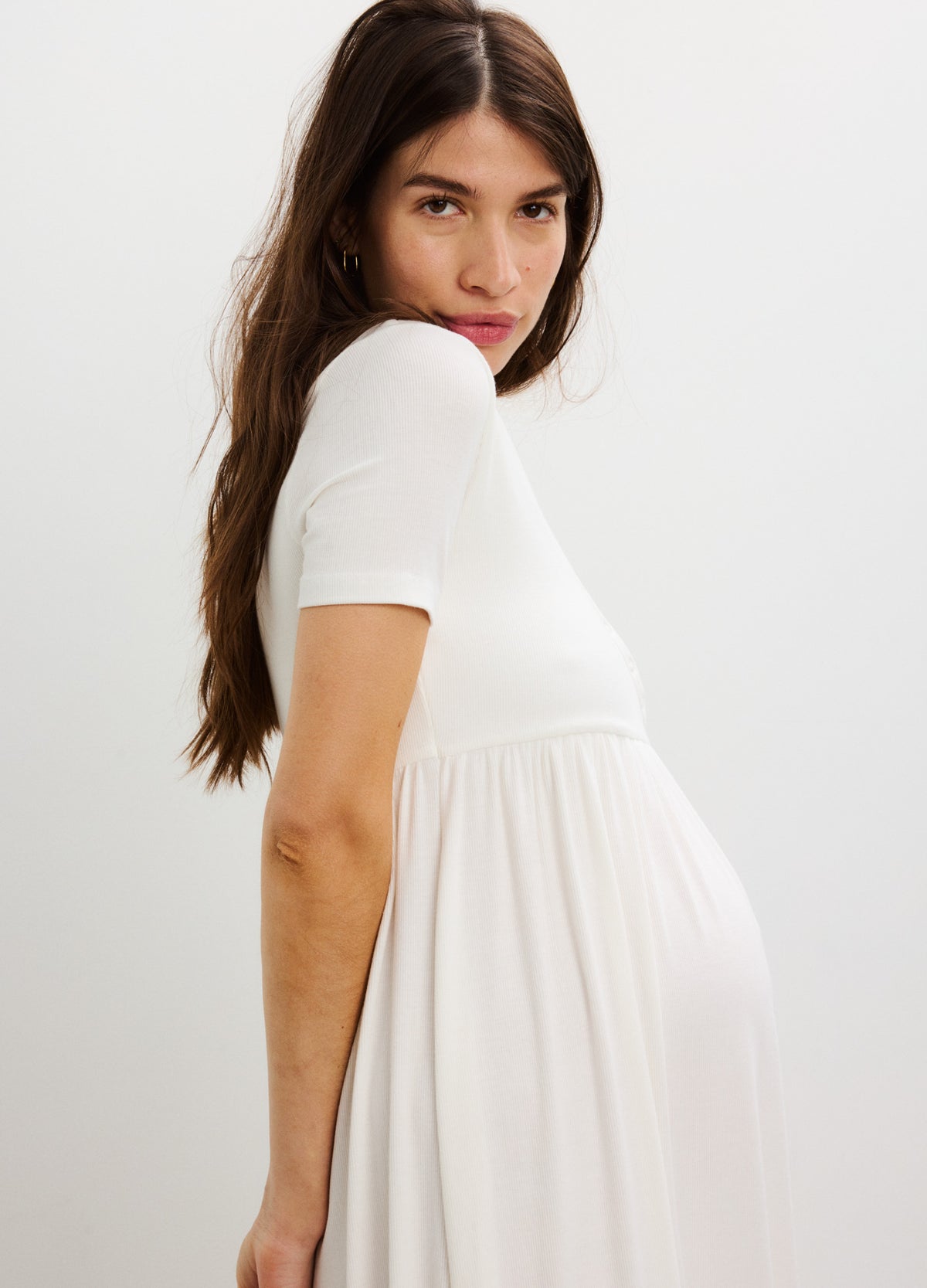 White ribbed knit maternity maxi dress with short sleeves and side seam nursing access.