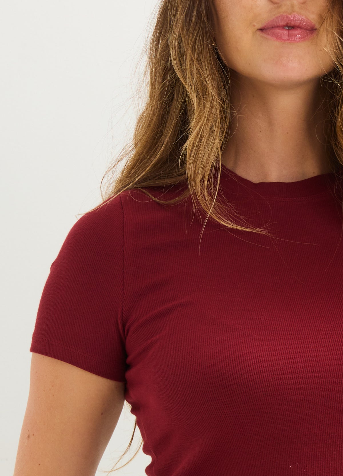 Maternity rib-knit tee in deep red with short sleeves and crew neckline.