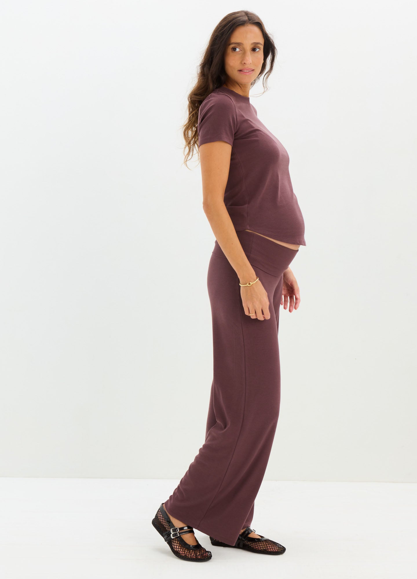 Maternity rib-knit tee and matching wide-leg pants in deep plum, soft stretchy fabric.