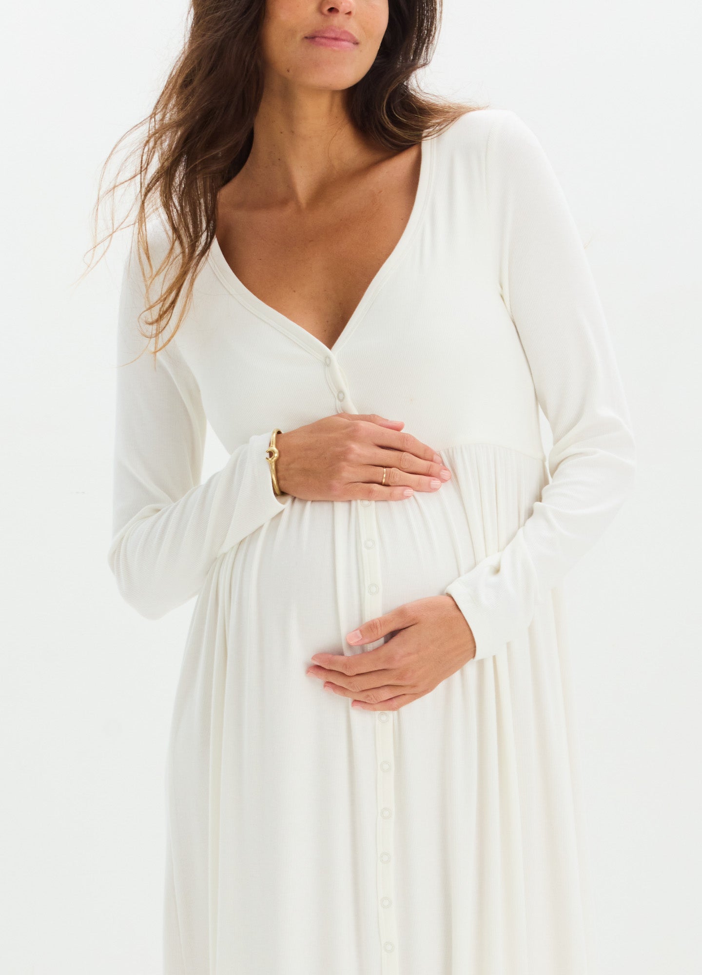 White ribbed knit nursing dress with long sleeves and V-neck, designed for maternity comfort.