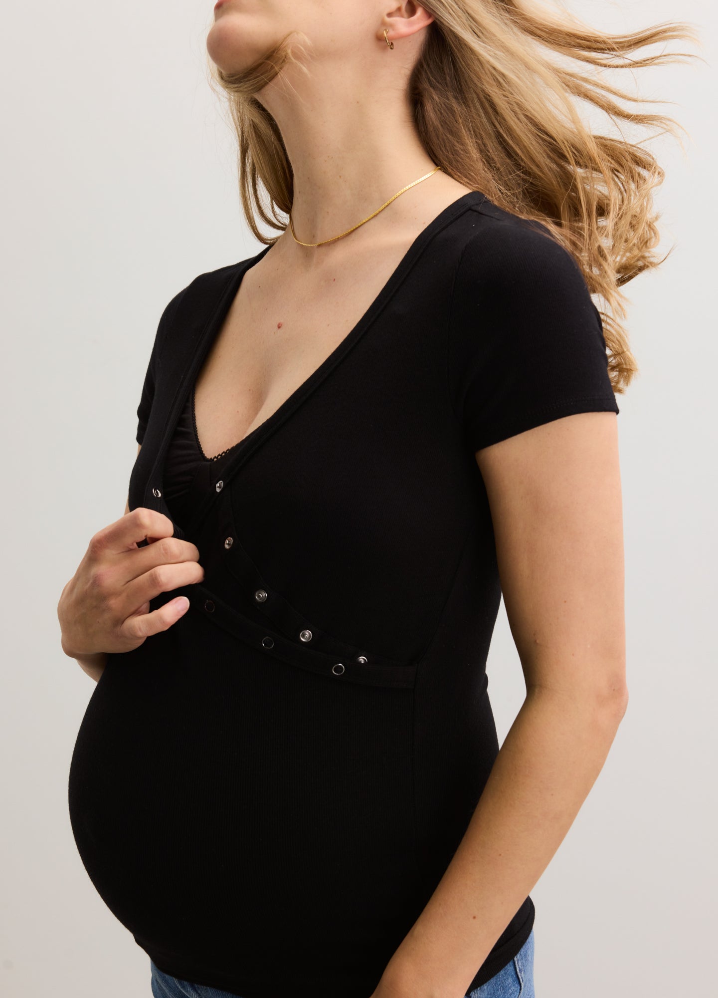Black ribbed maternity nursing tee with short sleeves and button-down front panel.
