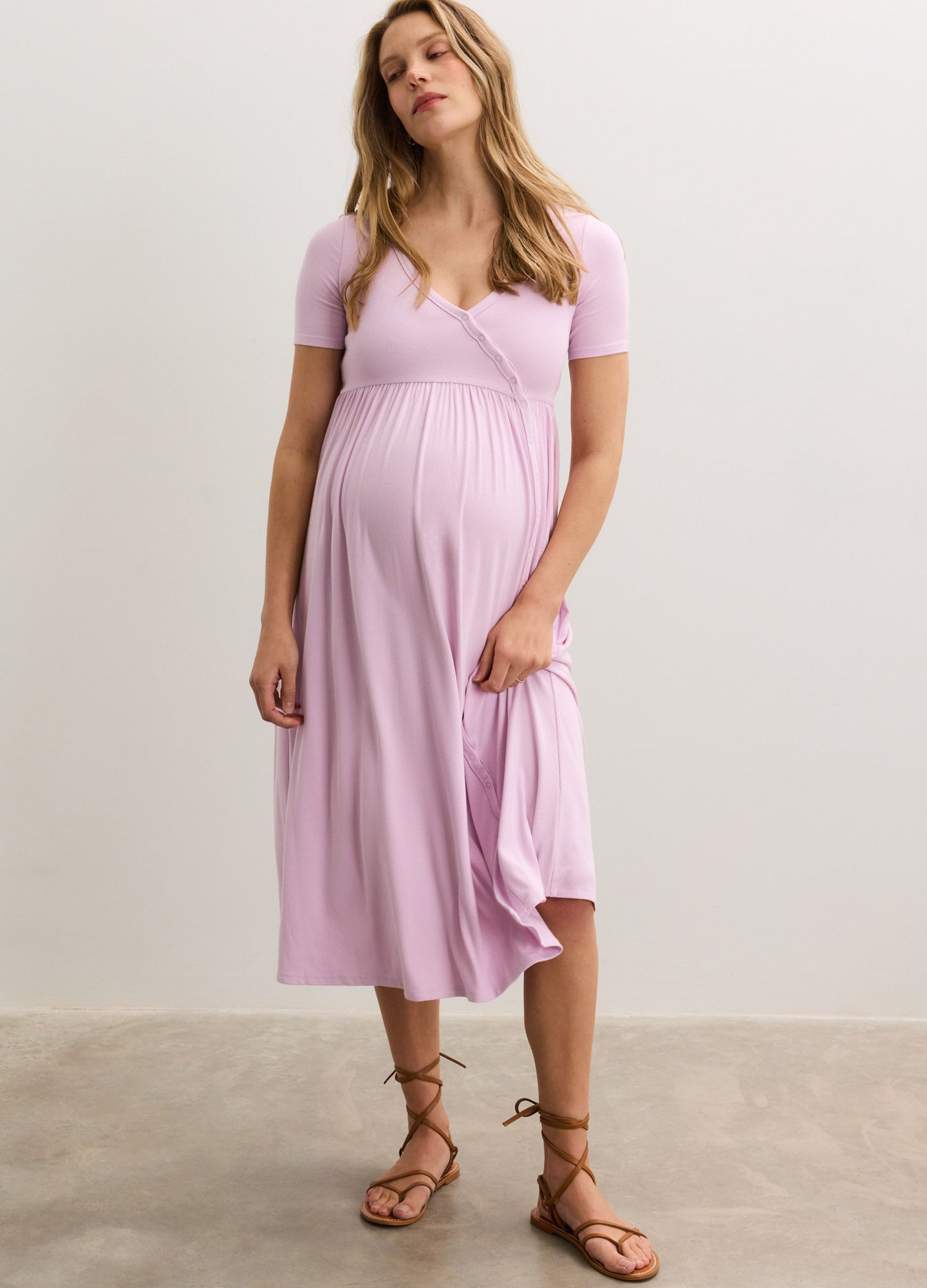 Light pink ribbed nursing maxi dress with short sleeves and side seams, worn by pregnant model.