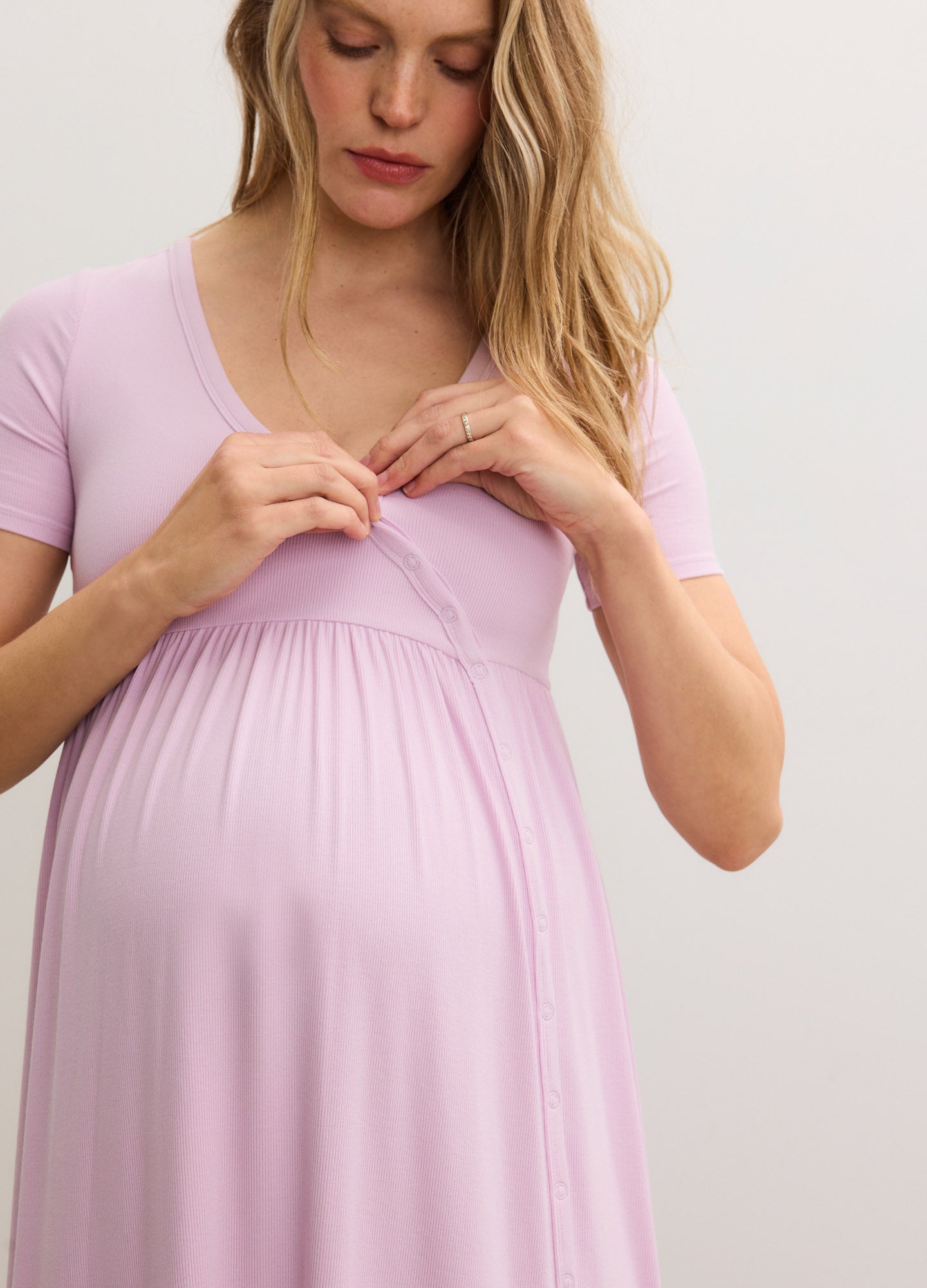 Light pink ribbed nursing maxi dress with short sleeves and side seams, designed for maternity and postpartum comfort.