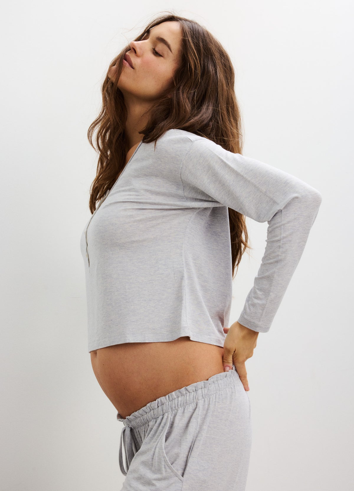 Light gray long sleeve maternity tee with soft fabric and relaxed fit, paired with matching lounge pants.