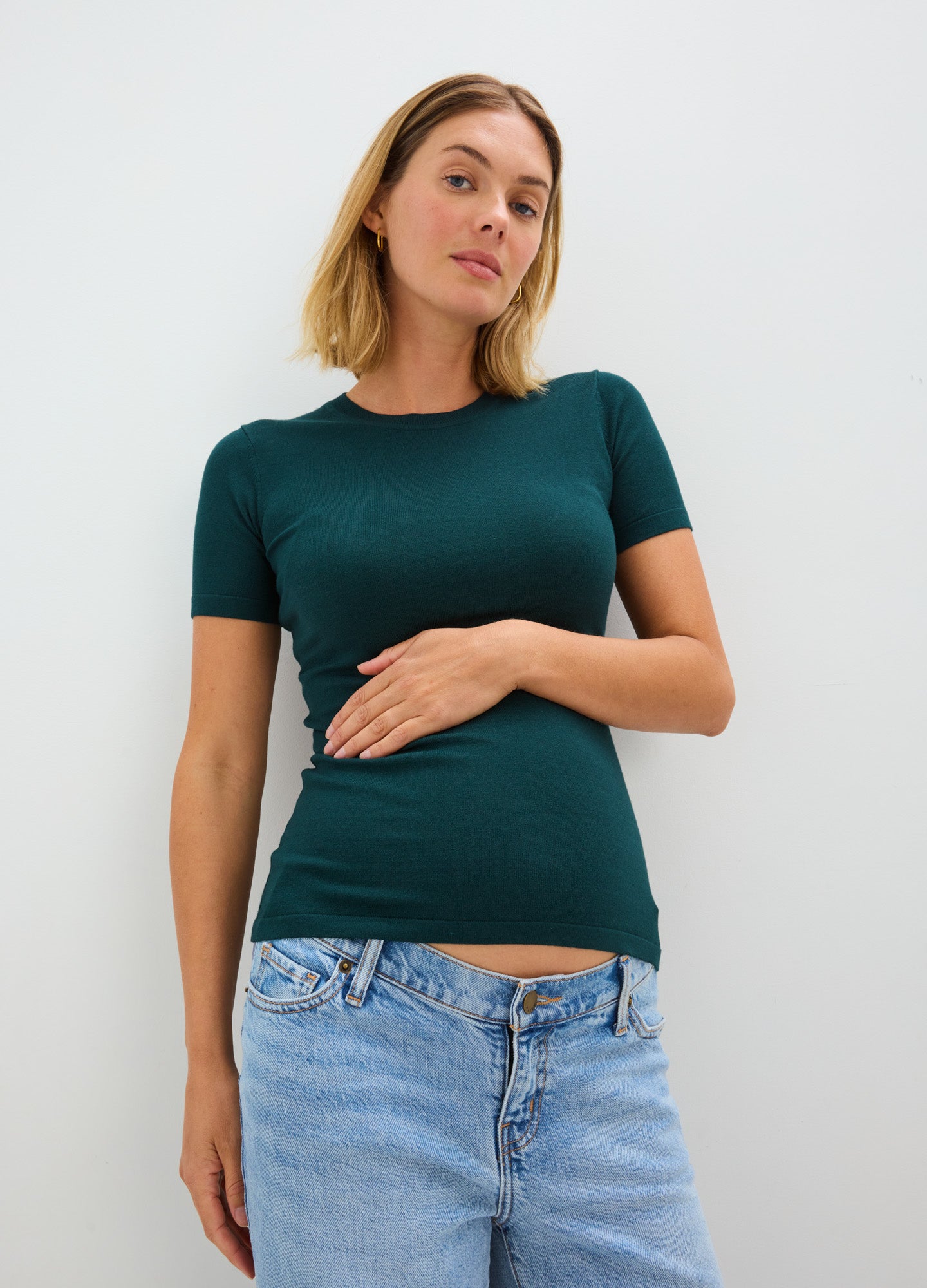 Teal short-sleeve knit maternity tee with stretchy, soft fabric and fitted silhouette designed for pregnant women.